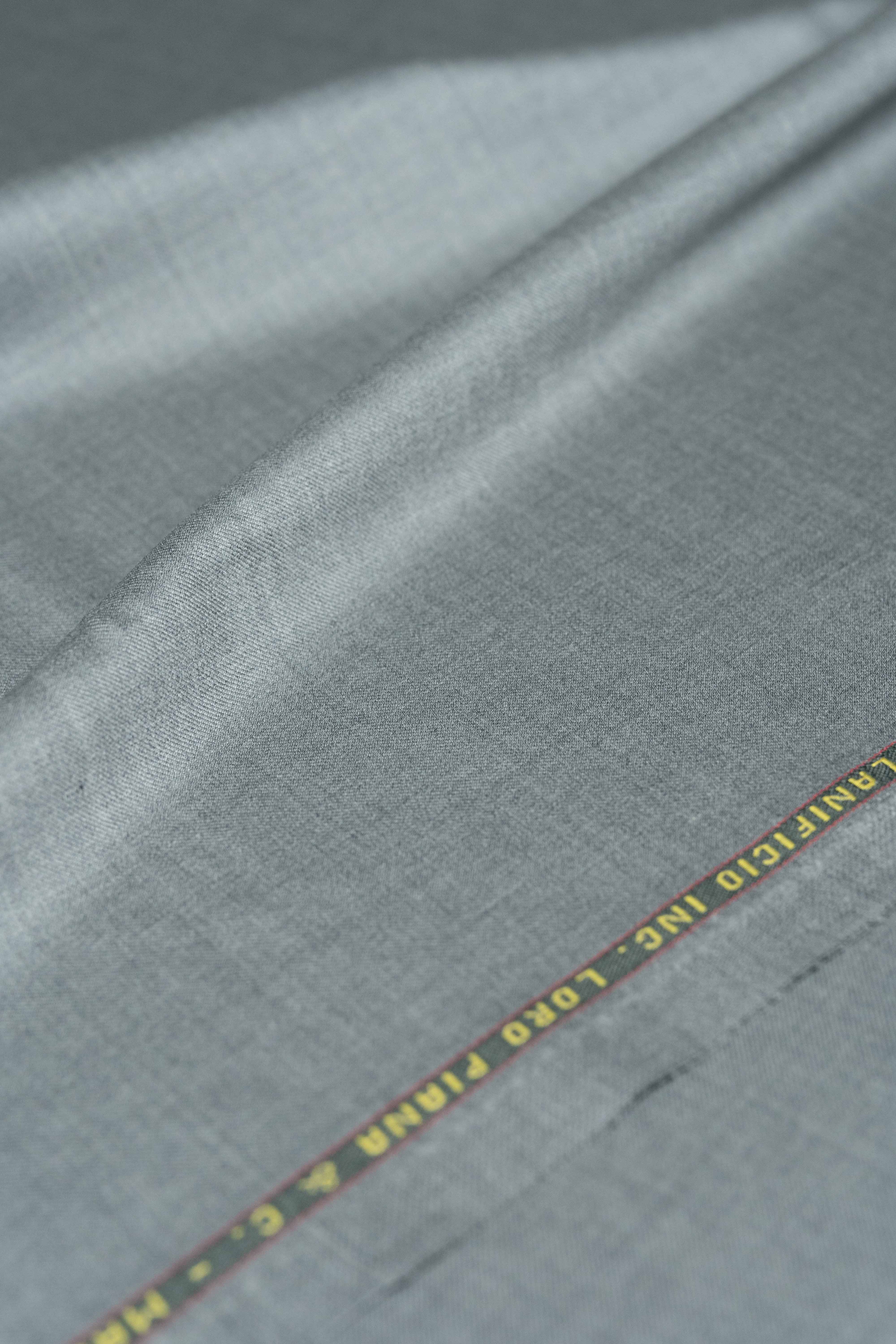Loro Piana Grey Australis 150's Merino Wool Suit Fabric showcasing its luxurious texture and quality craftsmanship.
