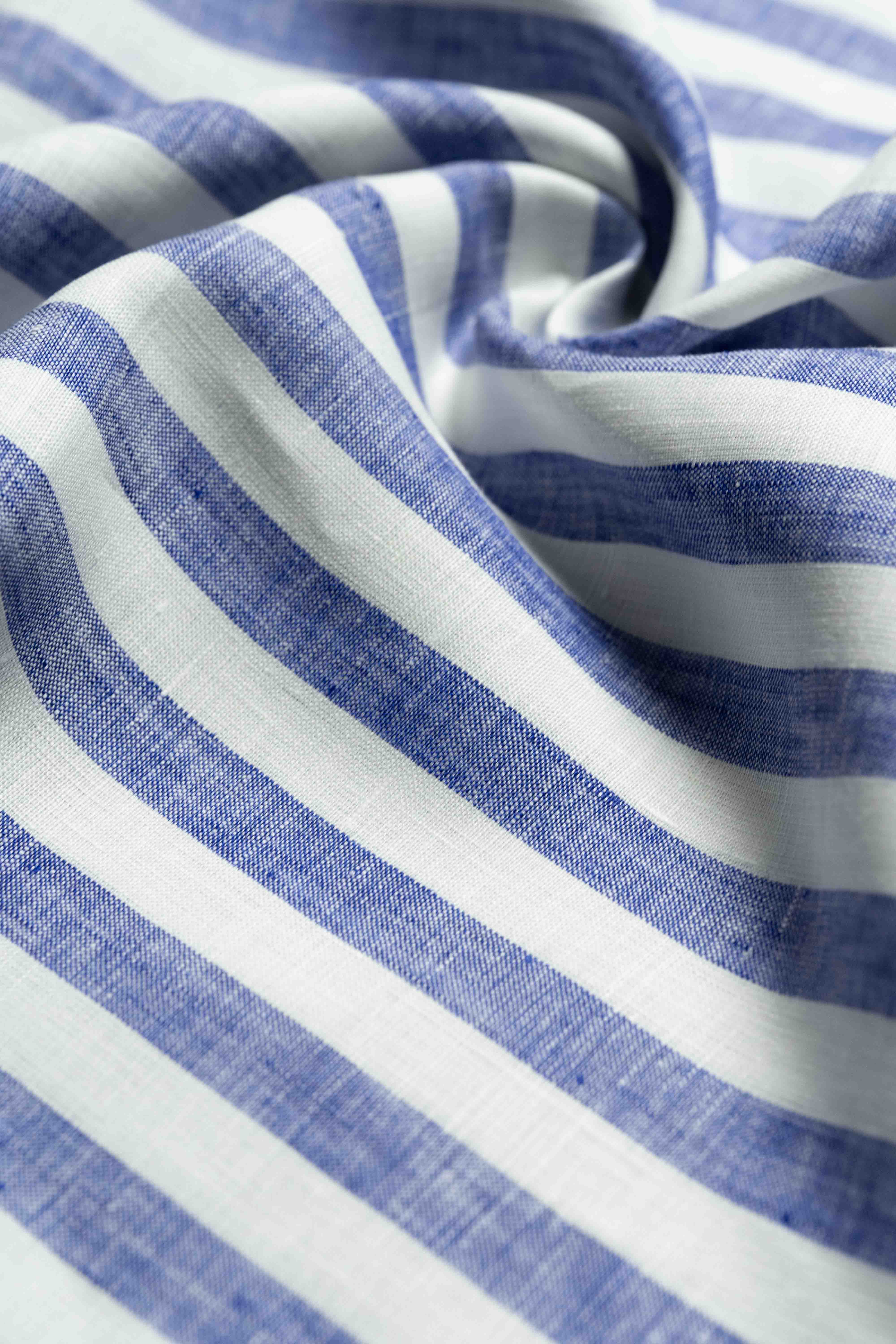 Solbiati Linen Navy Stripe Shirt Fabric showcasing blue and white stripes on high-quality linen texture.