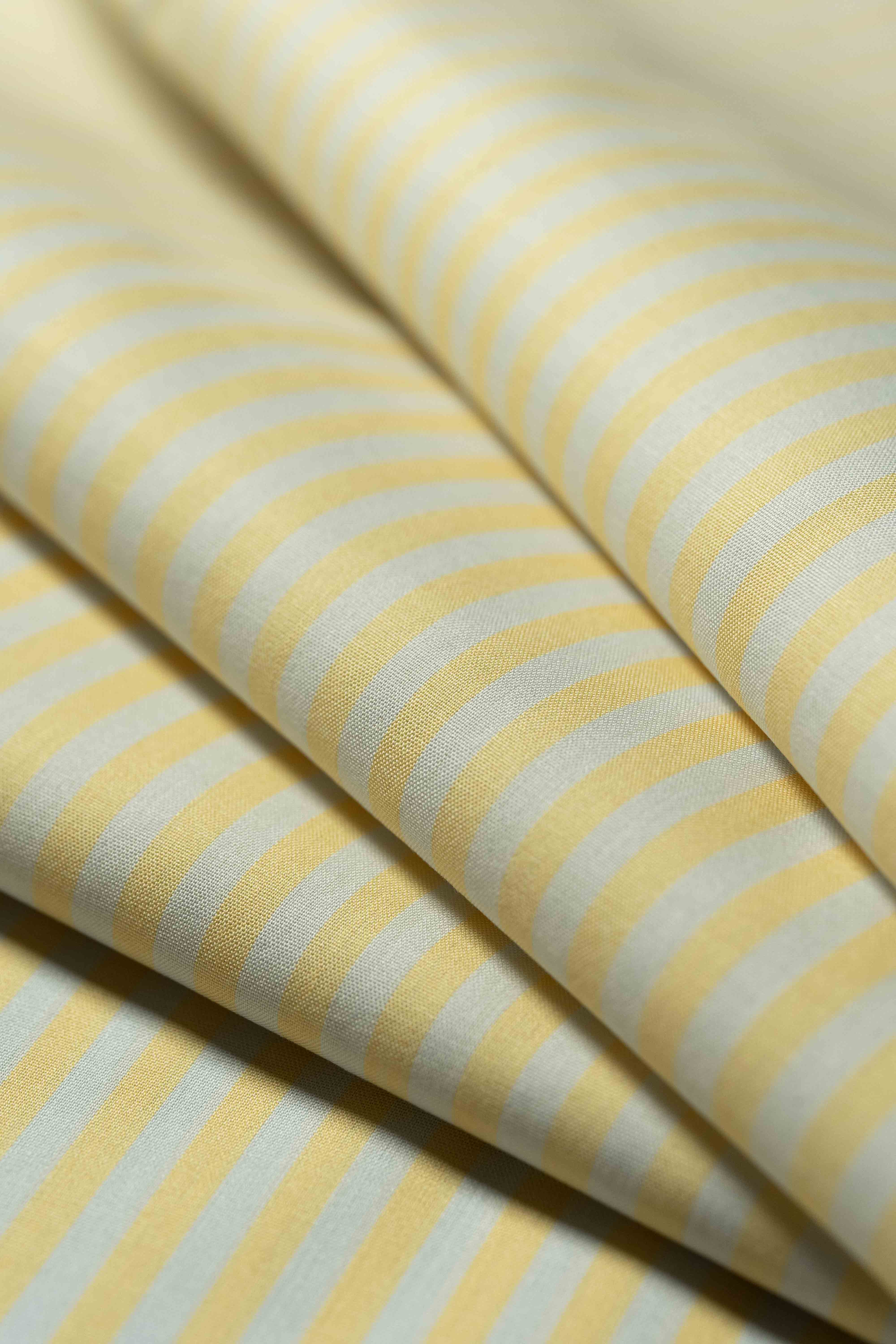 Carlo Riva Yellow Stripe Shirt Fabric featuring soft stripes in yellow and pale blue, width 90cm.