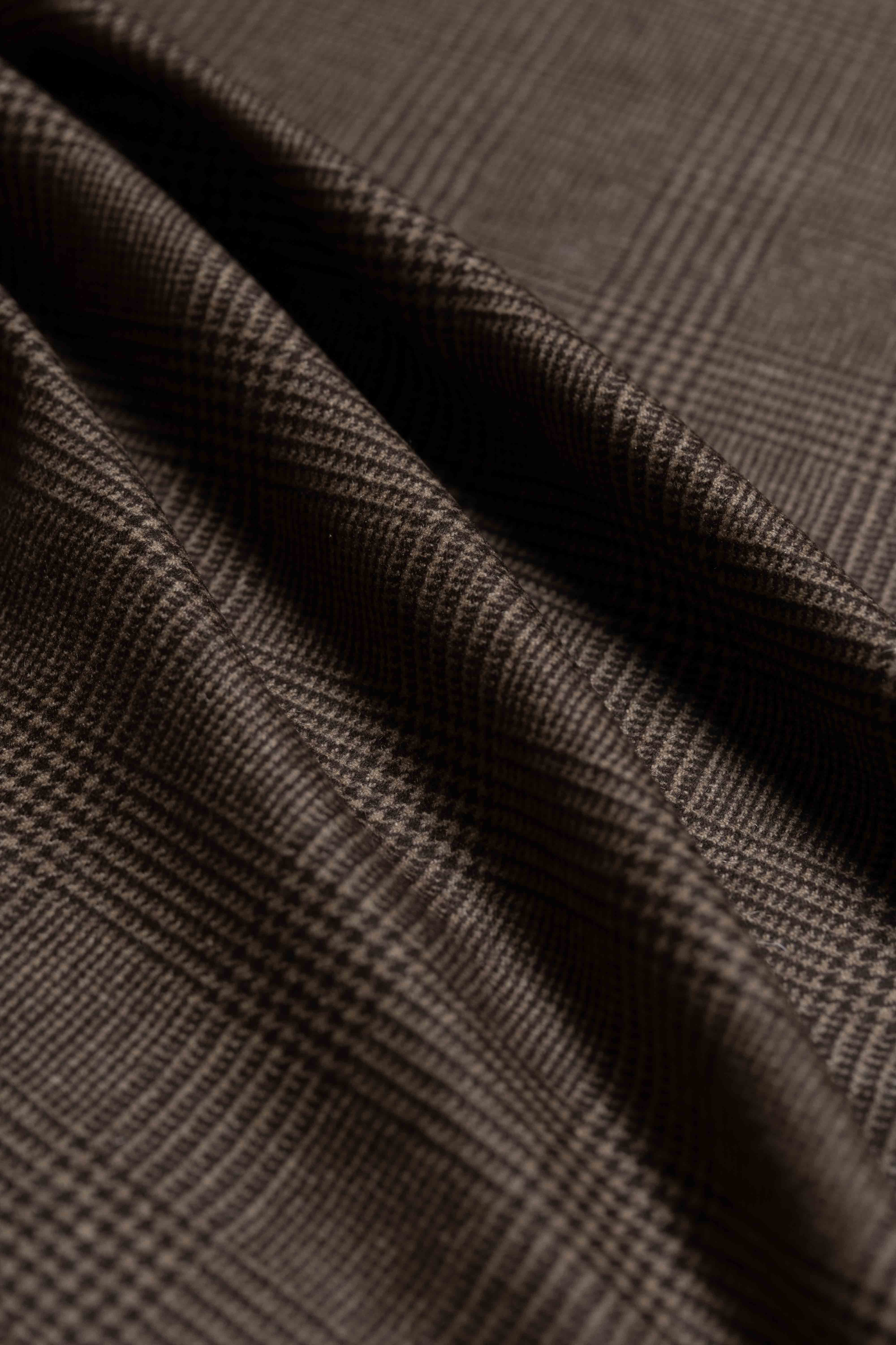 Close-up of Joshua Ellis Brown Glen Plaid Pure Cashmere fabric showcasing its luxurious texture and pattern.