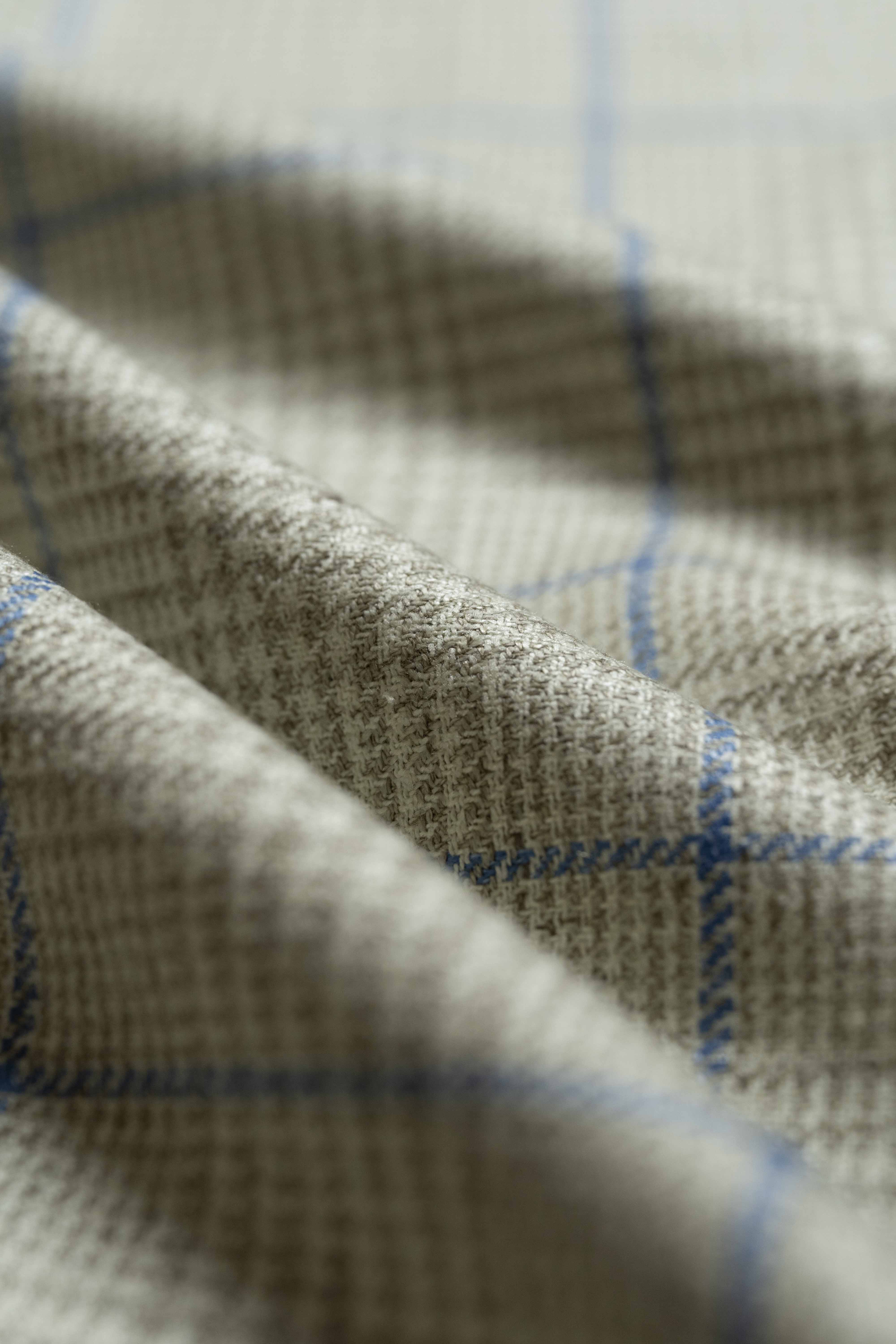 Marling & Evans blue check linen cotton suit jacket fabric close-up showing texture and pattern.