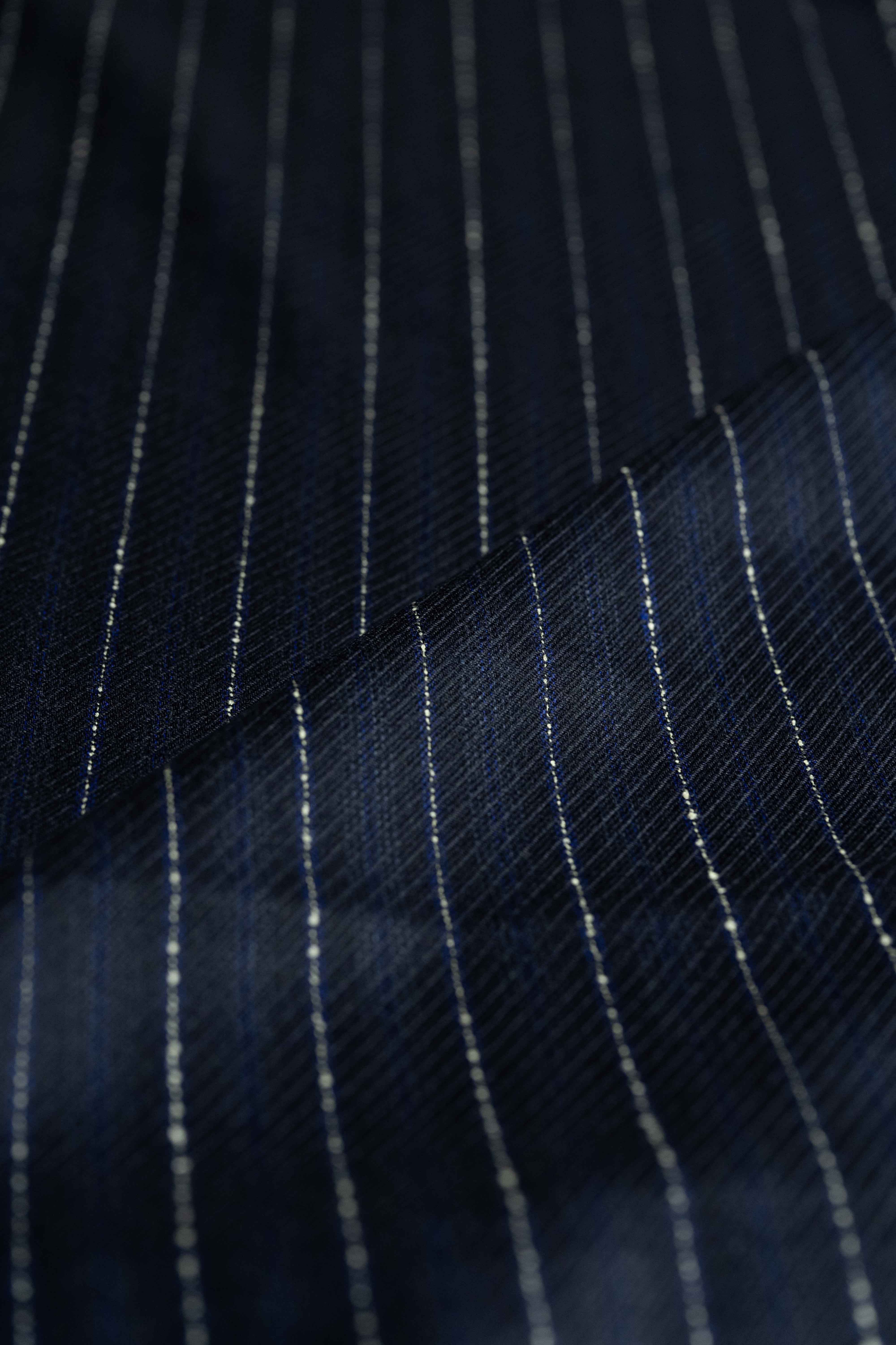 Dormeuil Blue & White Stripe Wool Suiting fabric detail showcasing fine stripes in navy and white.