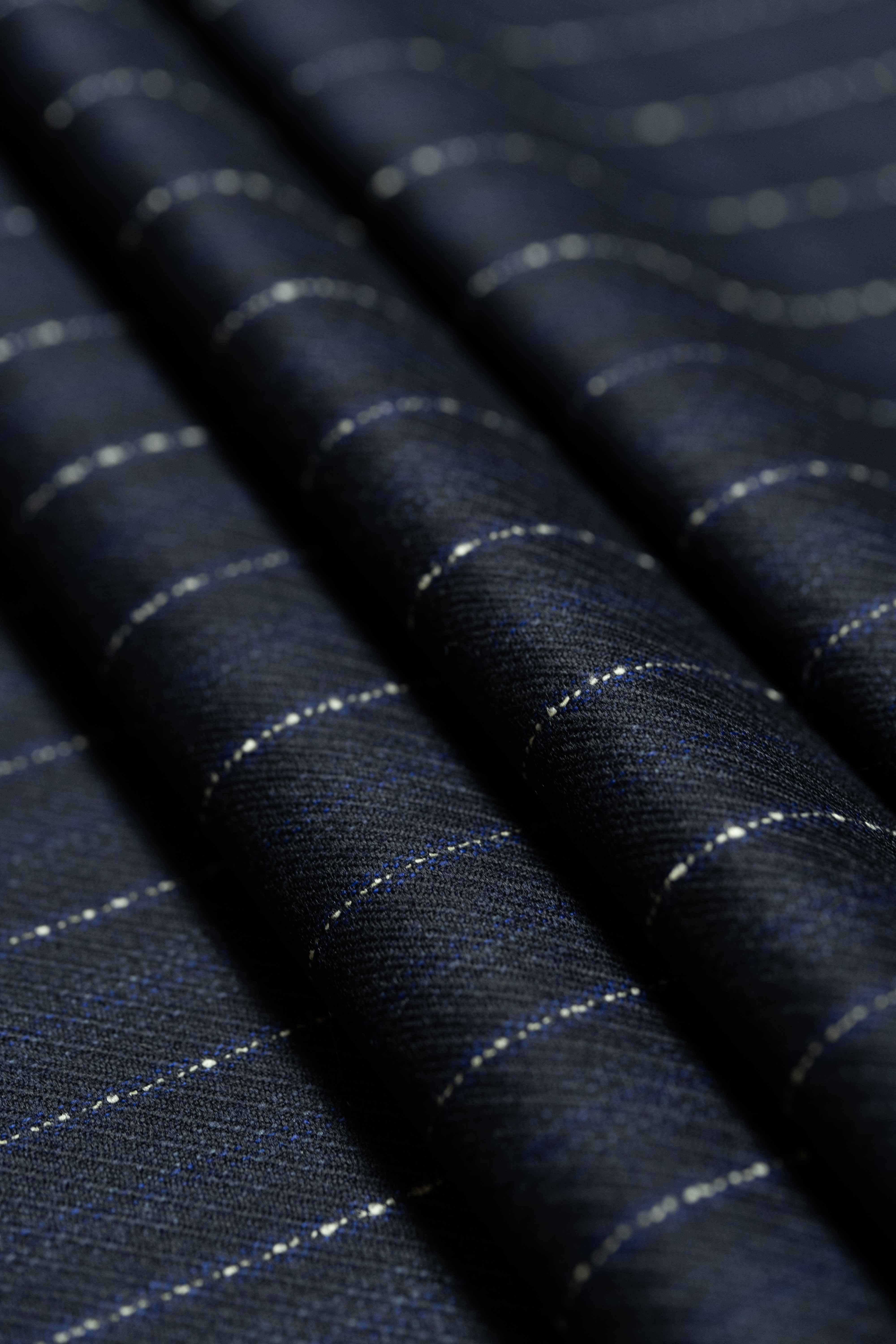 Dormeuil Blue & White Stripe Wool Suiting fabric detail showcasing fine craftsmanship and texture.