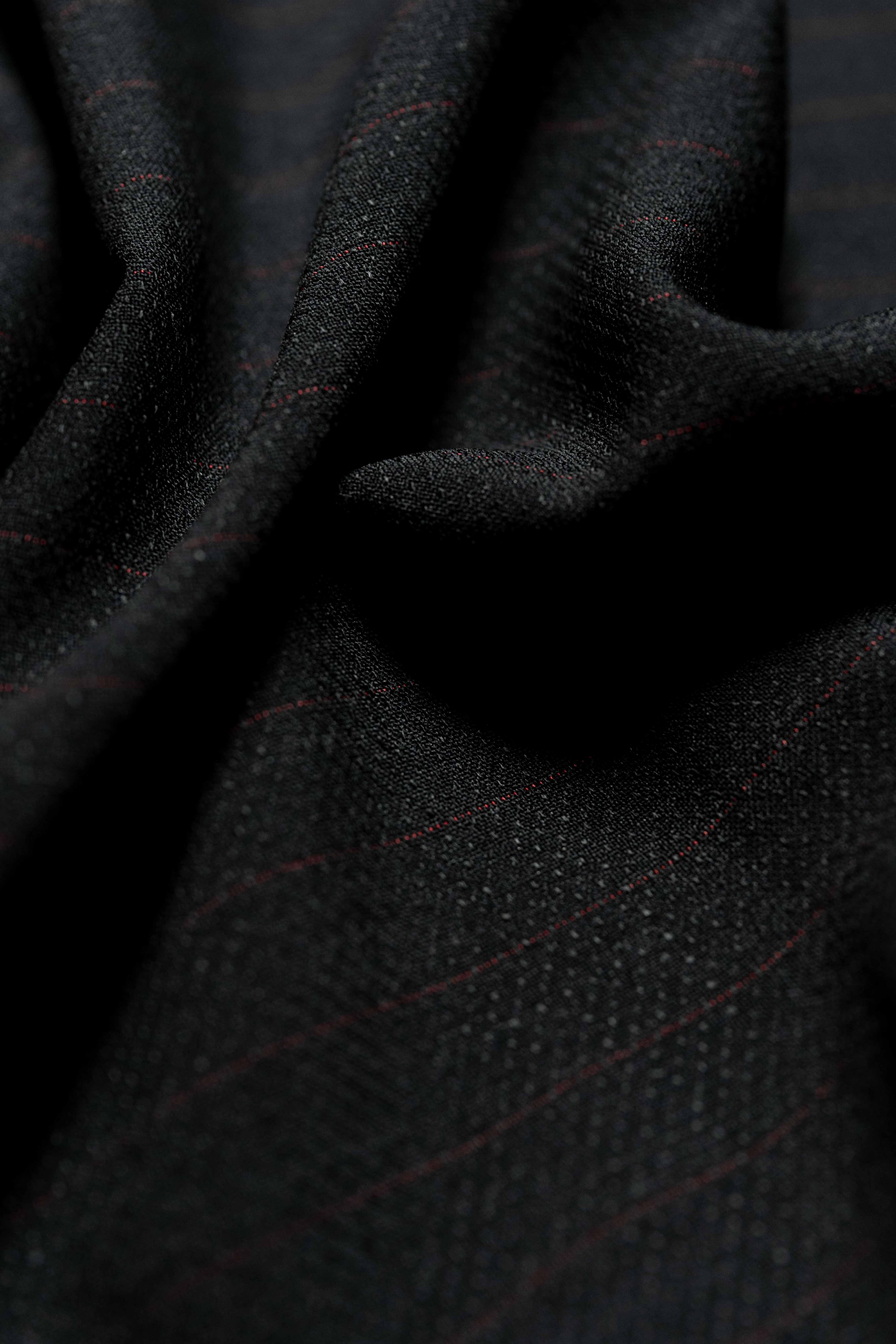 Loro Piana Black & Red Stripe Kid Mohair Suiting fabric close-up, showcasing its luxurious texture and design.