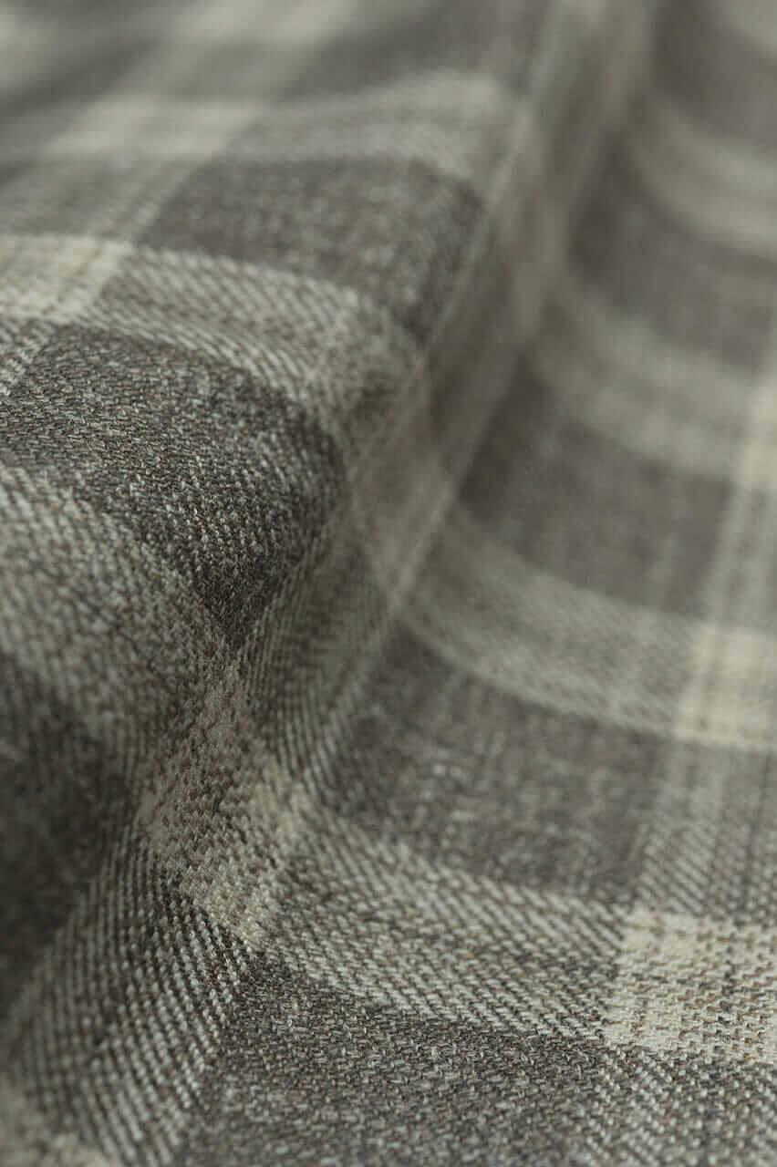 Close-up of textured herringbone jacket fabric showcasing a stylish plaid pattern, ideal for Jacket Fabric.