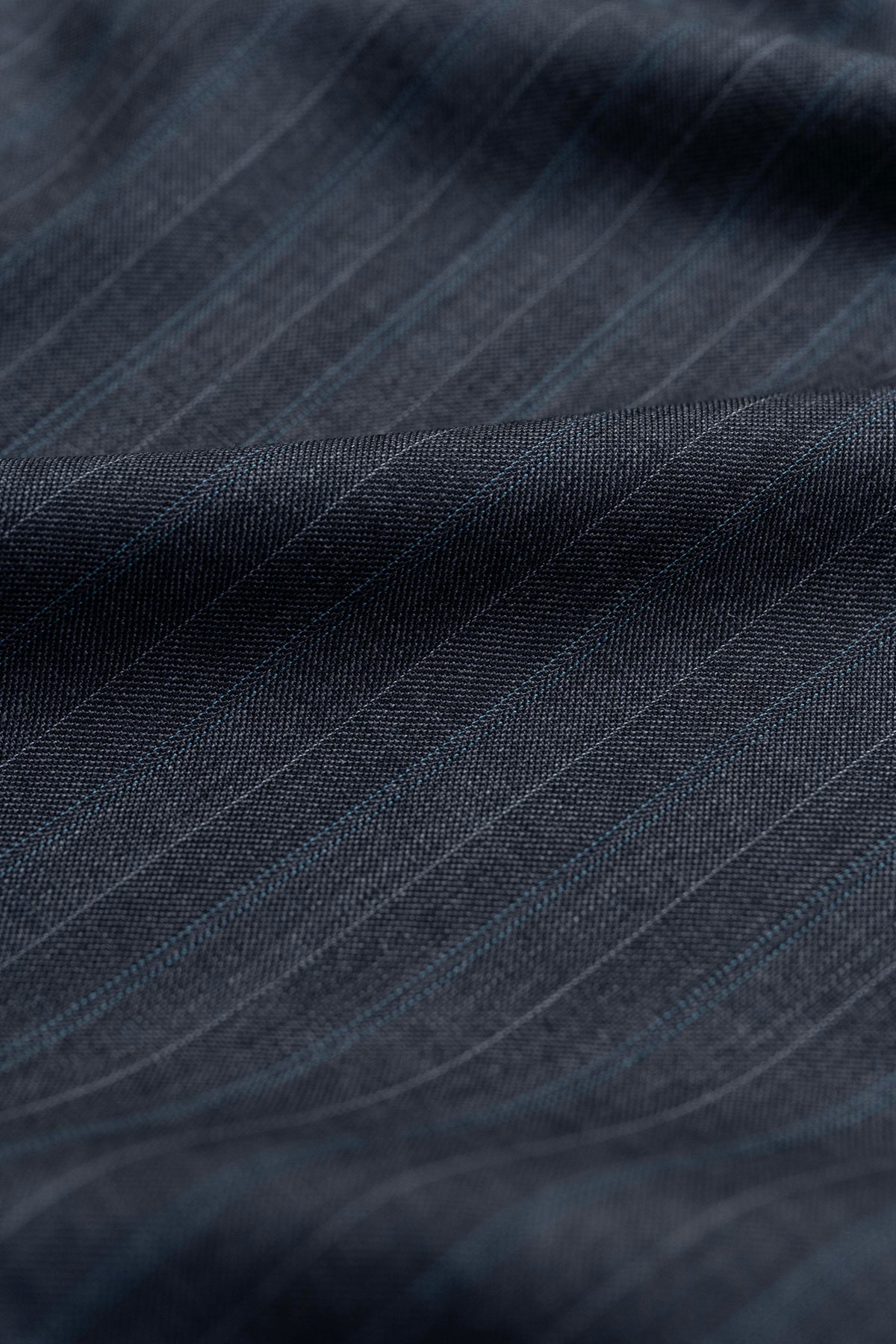 Close-up of Barrington Panama Weave fabric showcasing charcoal color and blue stripe for elegant suiting.