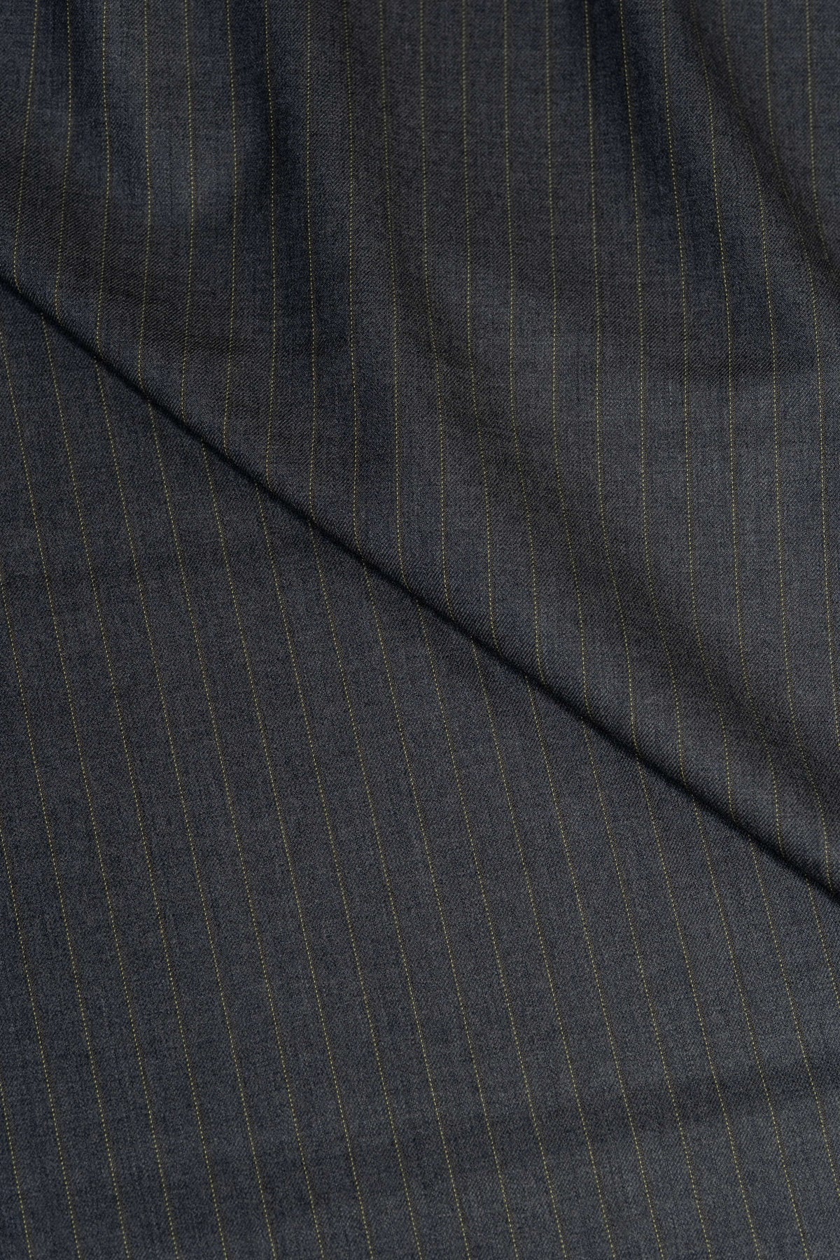 Super merino wool suiting fabric in grey with yellow stripes, ideal for tailored suits and stylish designs.