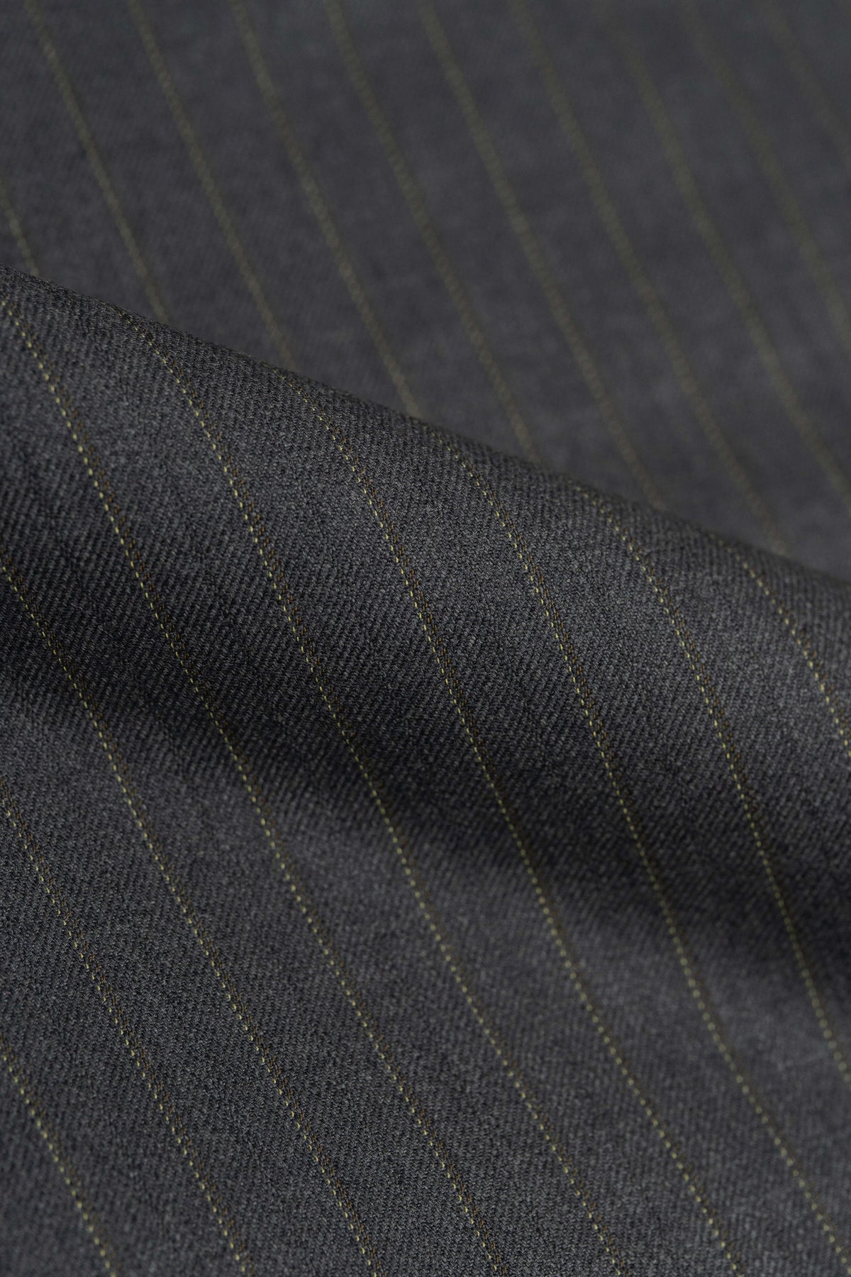 Barrington Grey Super Merino Wool Suiting fabric featuring a subtle yellow stripe, ideal for stylish tailoring.