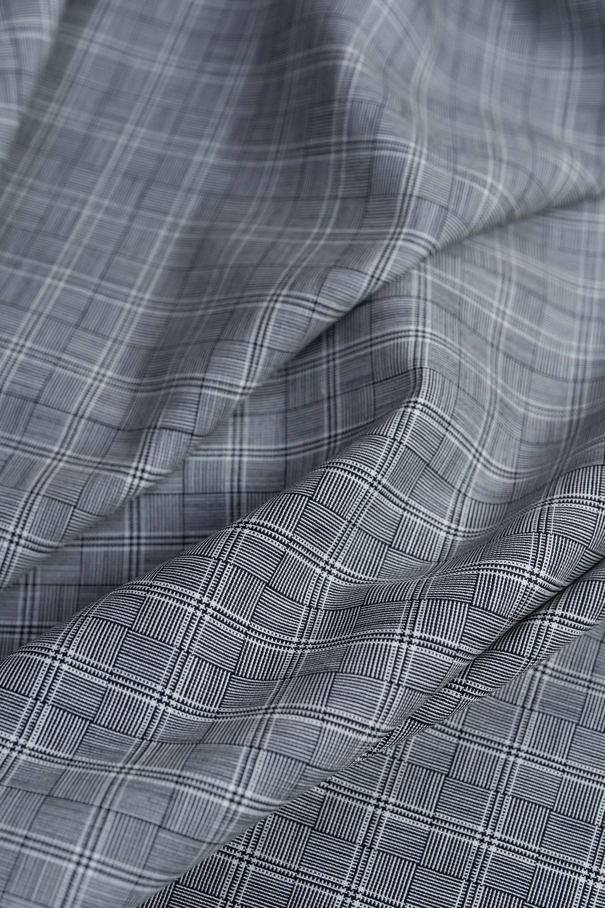 Barrington Panama Weave black and white check wool jacketing fabric showing intricate woven pattern.