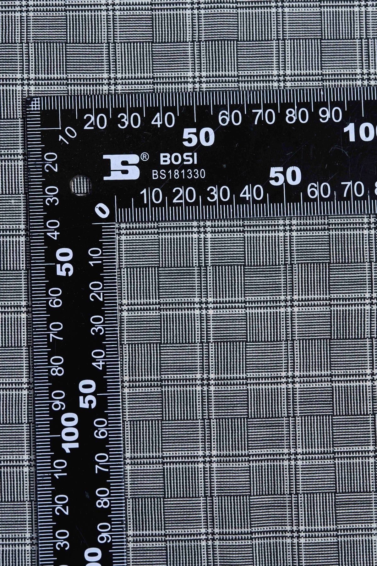 Barrington Panama Weave black and white check wool jacketing fabric with measuring ruler.