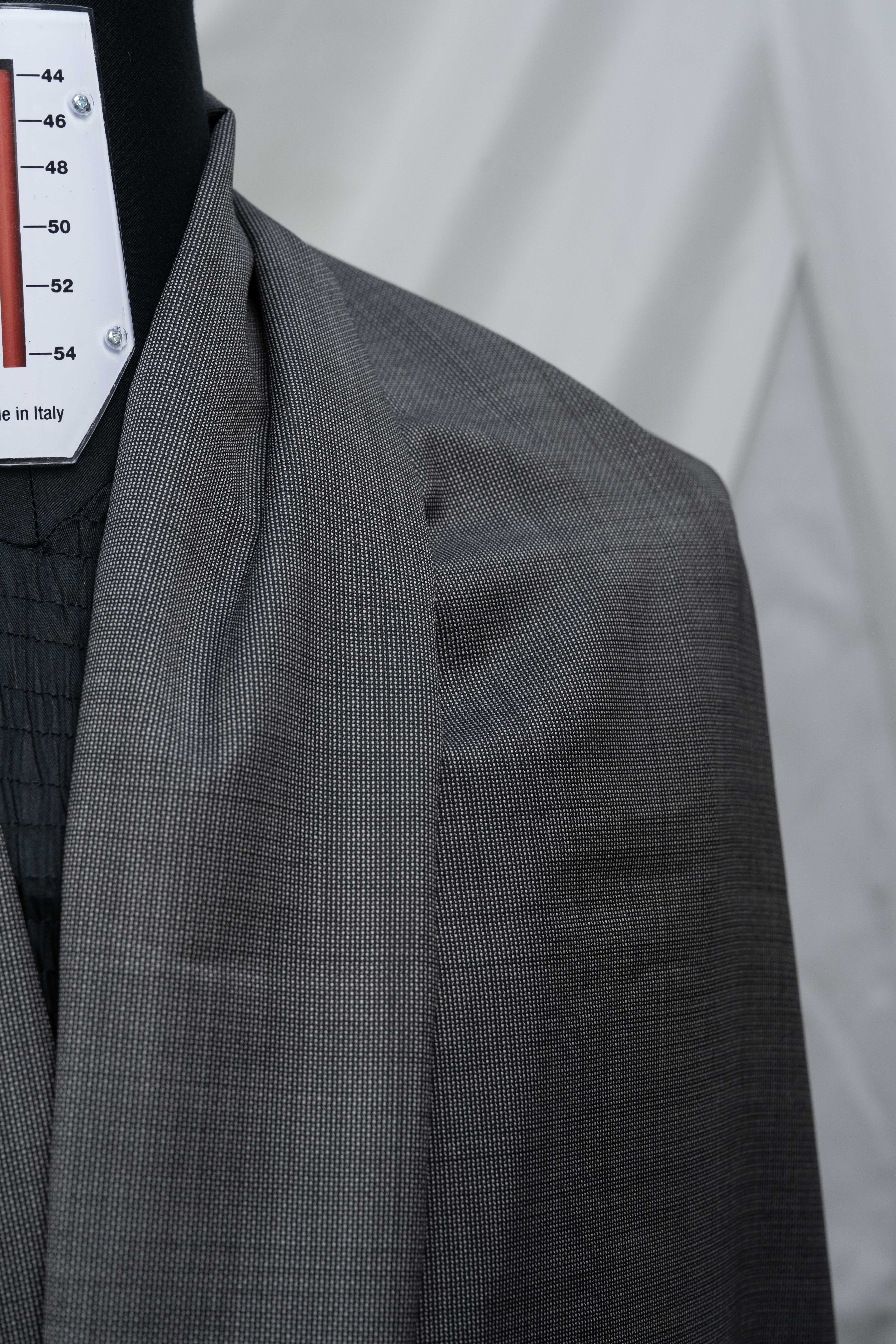 Close-up of VBC Lightweight Super 120's wool suit fabric draped on a mannequin, showcasing its texture and quality.