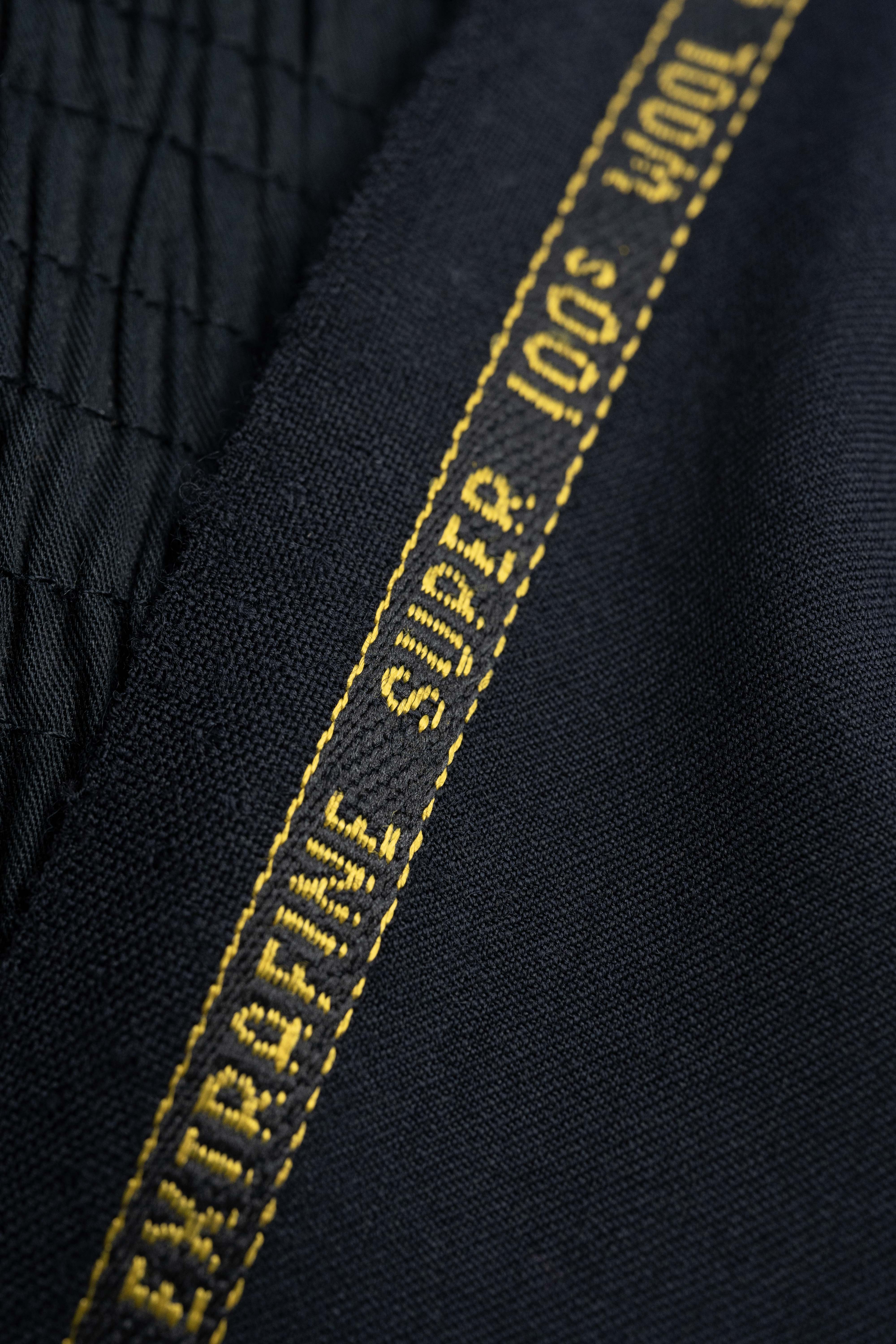 England Black Super 100's Wool Suiting Fabric close-up showing texture and quality.