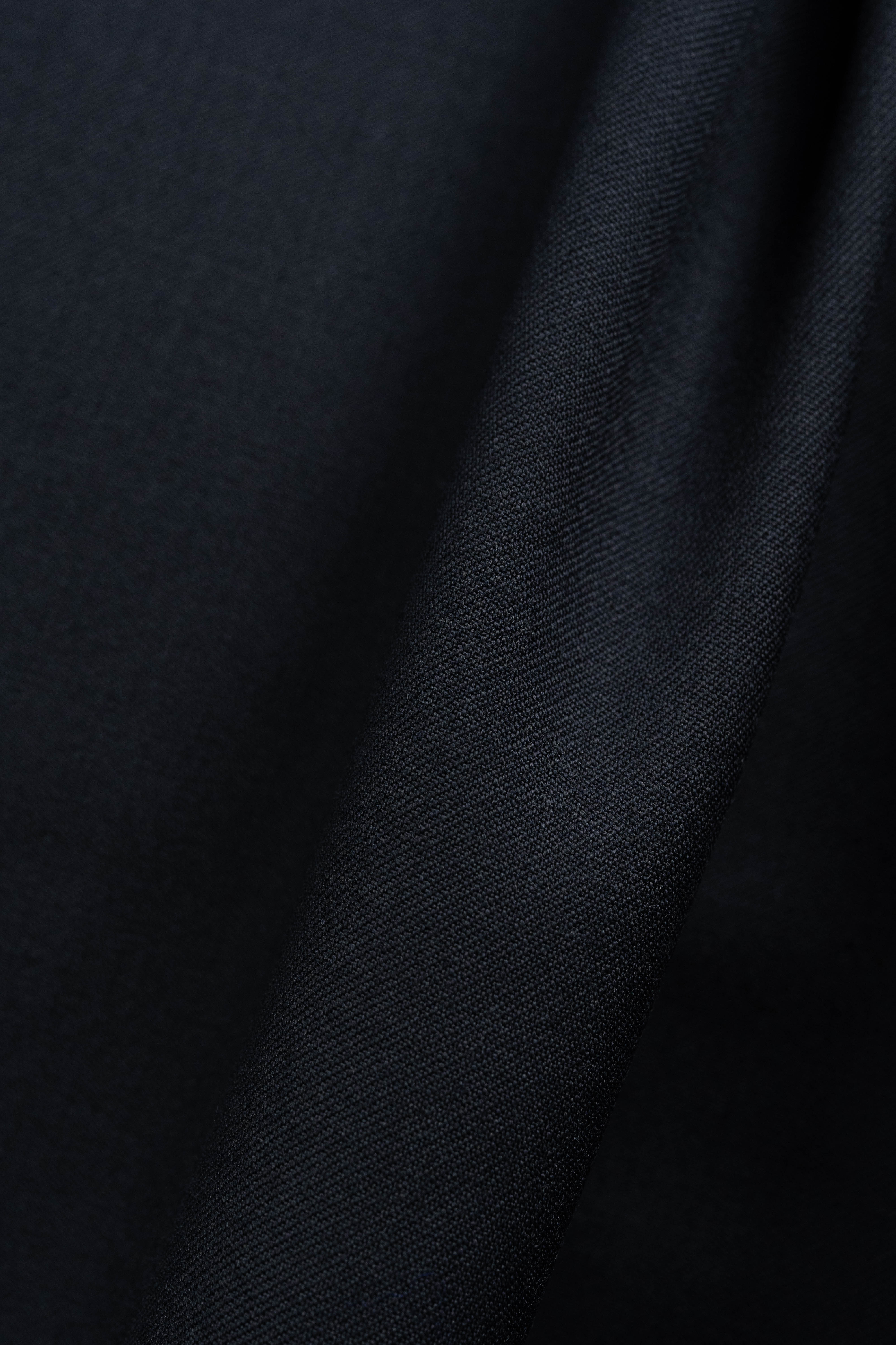 England Black Super 100's Wool Suiting Fabric close-up fabric texture image
