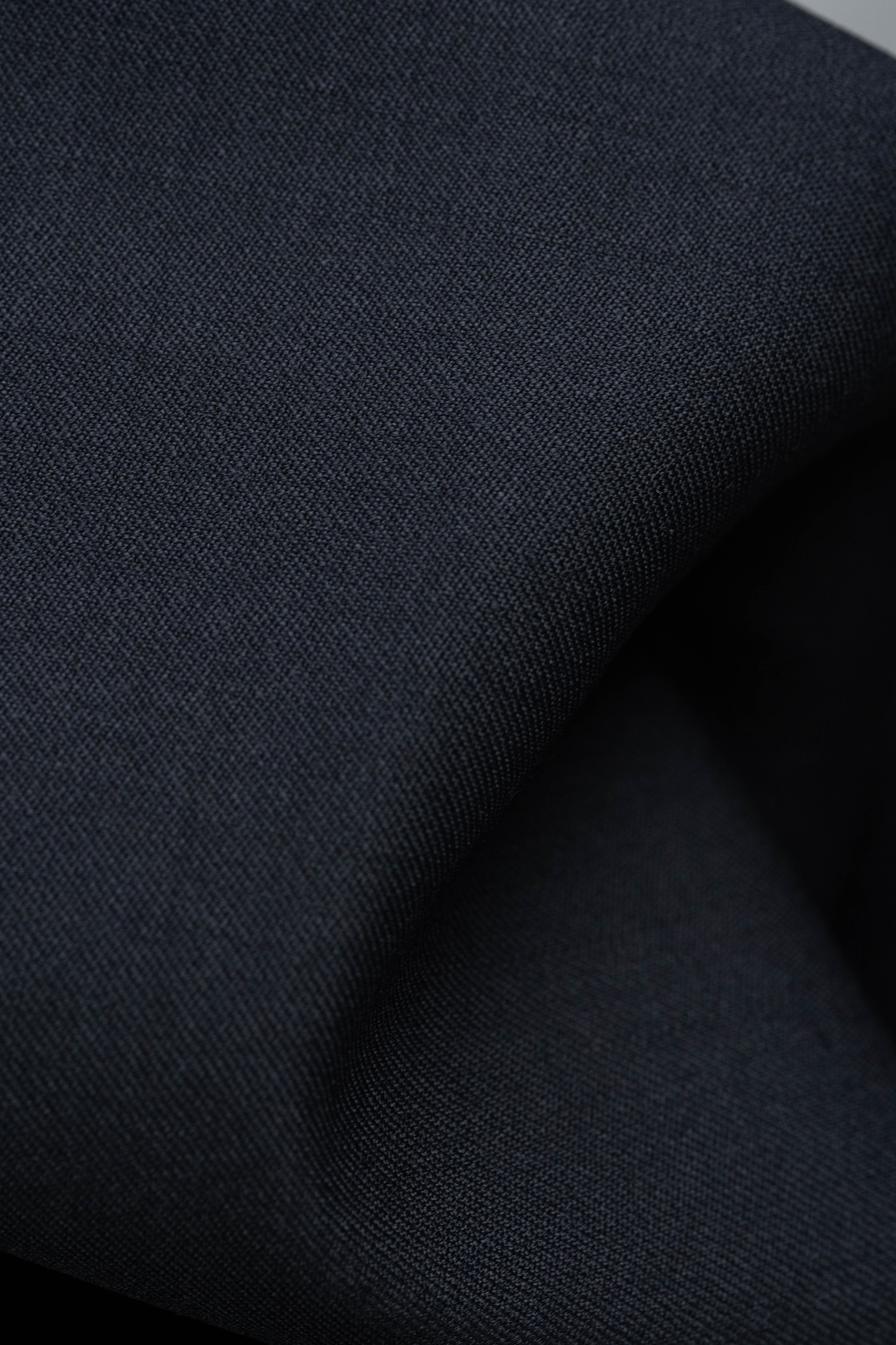 England Black Super 100's Wool Suiting Fabric (V23737) showcasing a close-up of the fabric texture.