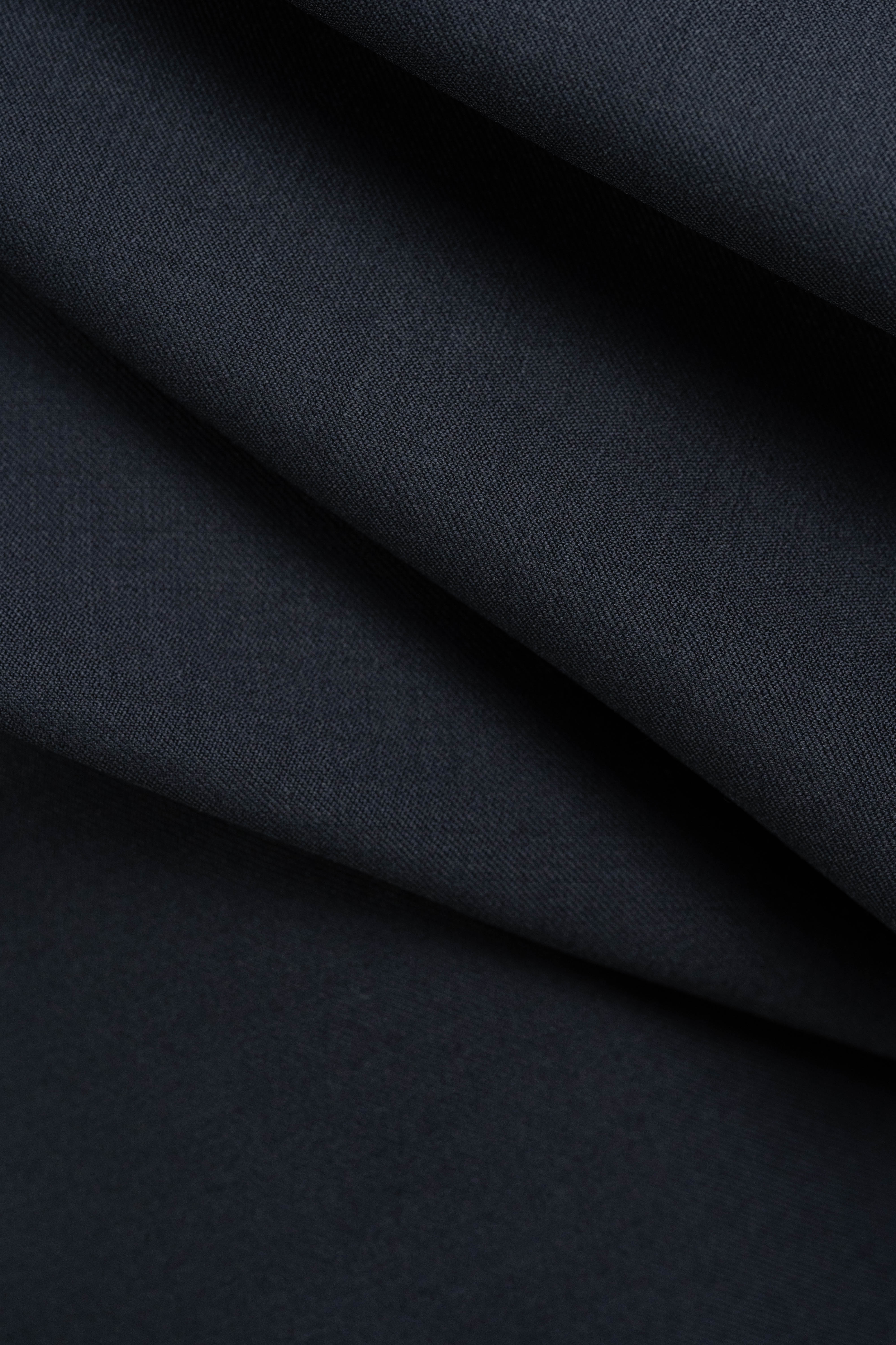 England Black Super 100's Wool Suiting Fabric image showing the soft texture and deep color of the material.