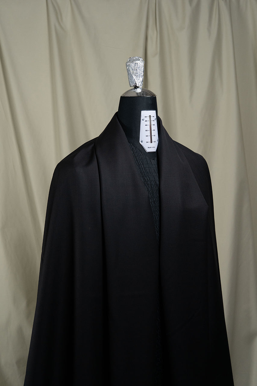 CERRUTI 1881 Black Plain Nobility Super 150's Wool Suiting-3 Meters on a mannequin.