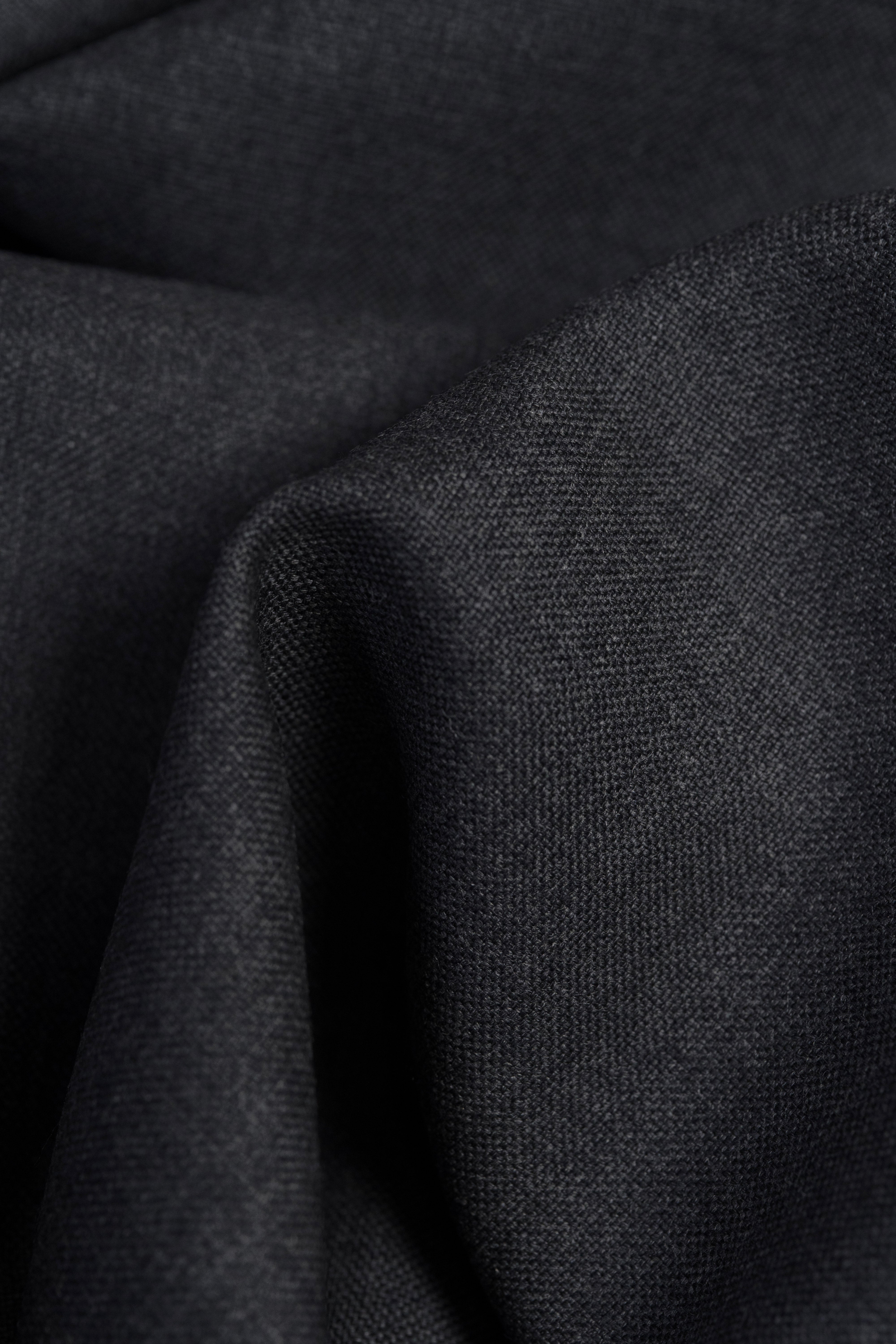 Close-up of Groves & Lindley dark grey wool suit fabric texture.