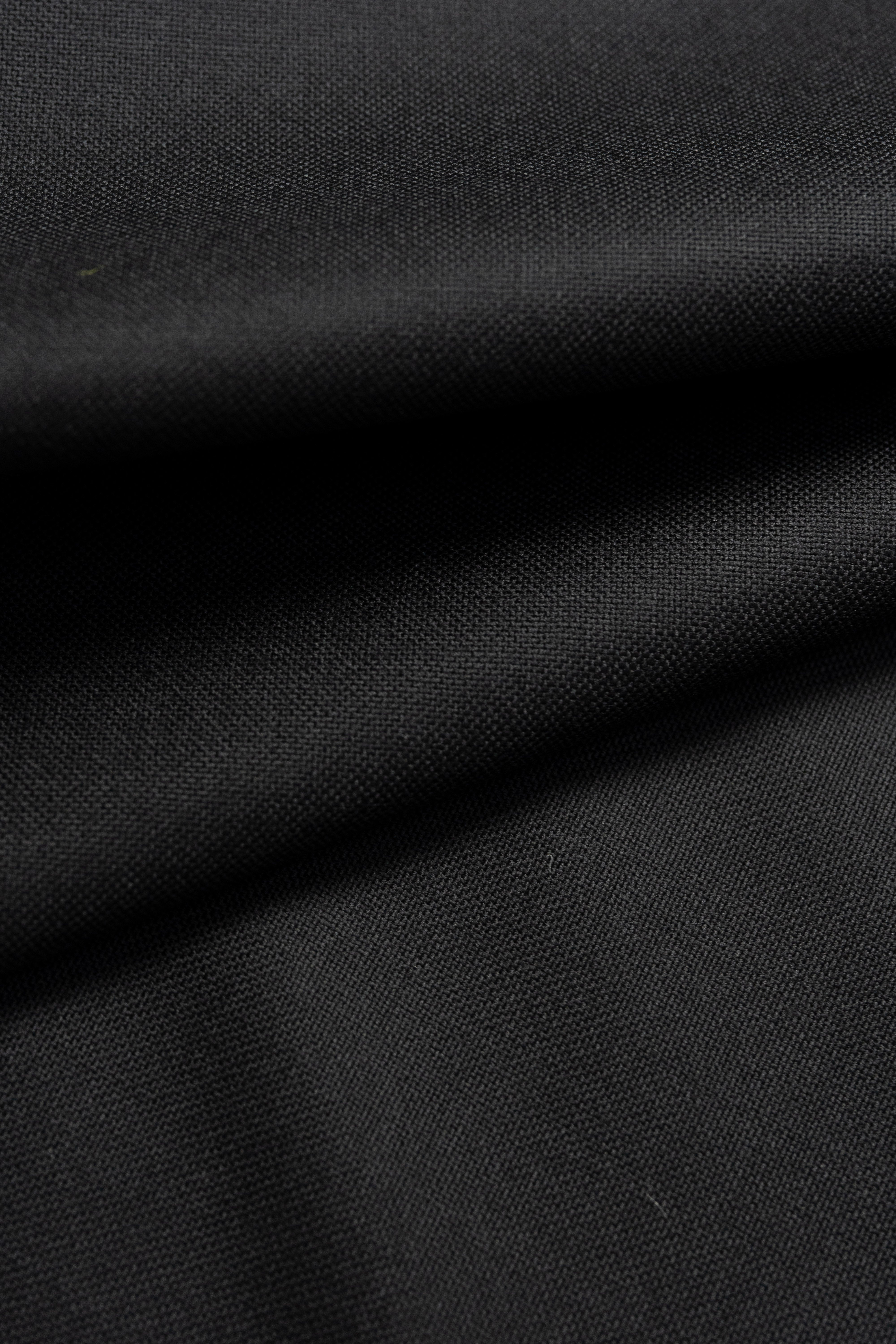 Groves & Lindley black wool suit fabric showcasing a smooth and luxurious texture, ideal for tailored suits.