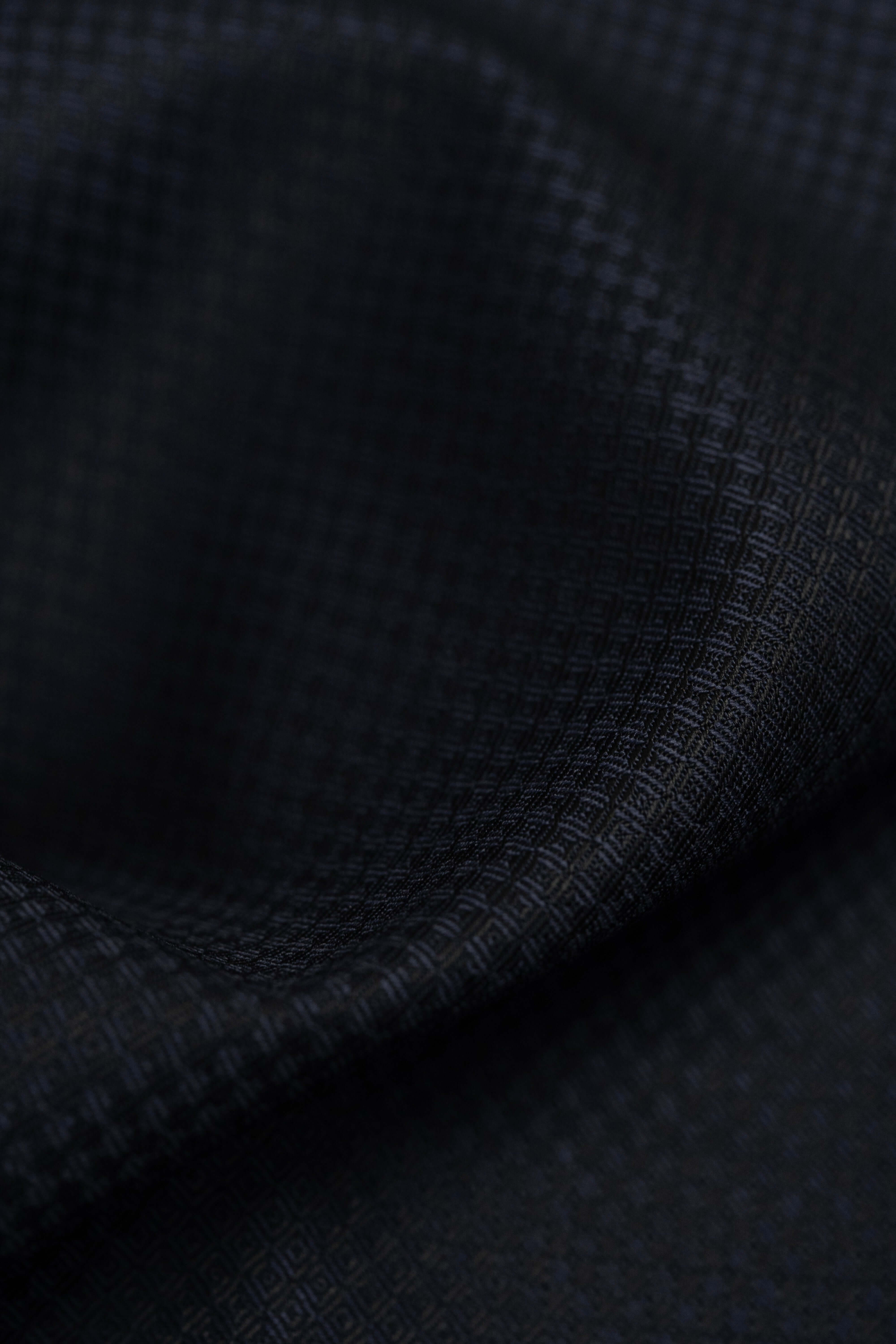 Barrington Panama Weave Dark Navy Geometric Pattern Wool Suiting fabric close-up, showcasing texture.