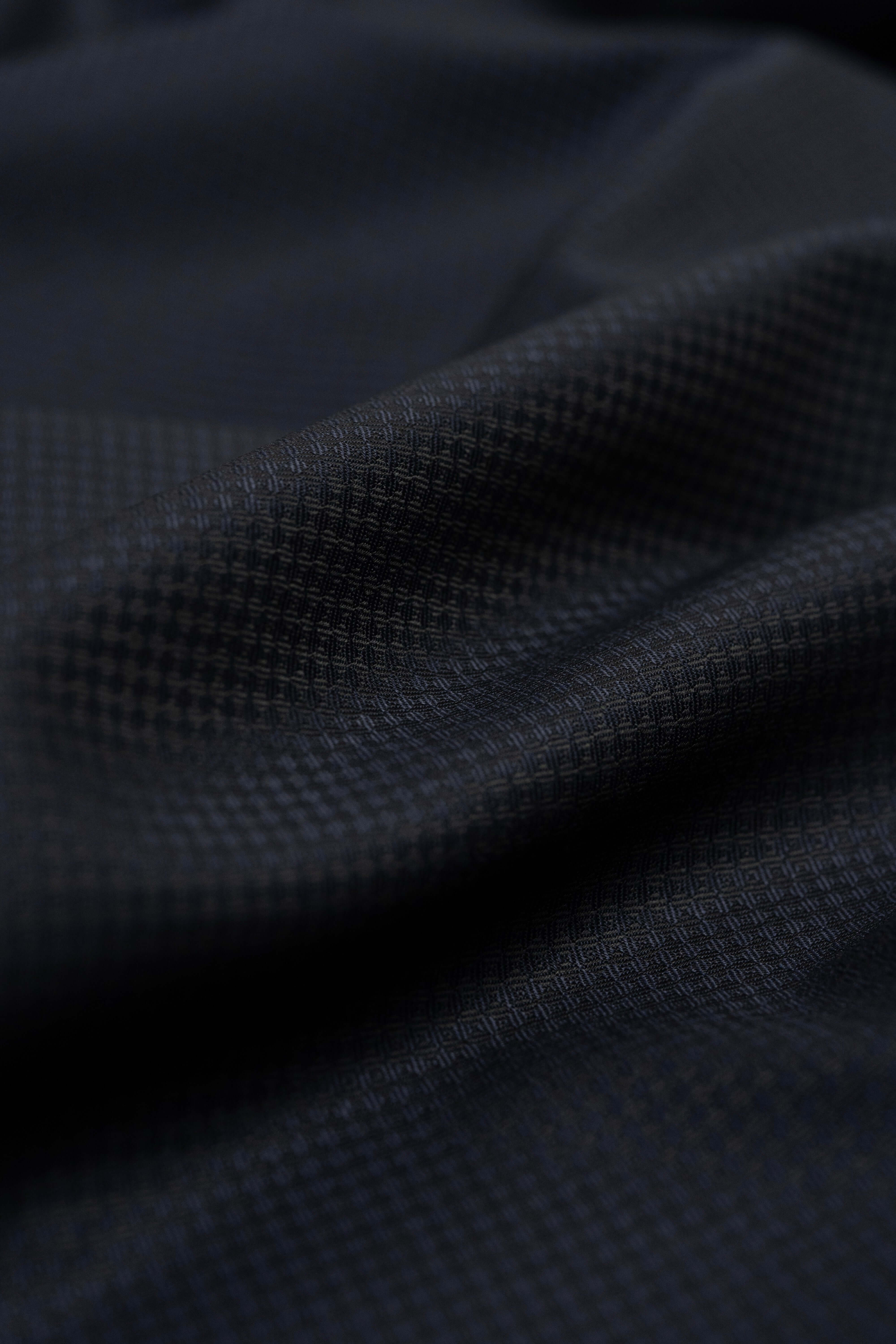 Close-up view of Barrington Dark Navy Geometric Pattern Wool Suiting fabric featuring Barrington Panama Weave.