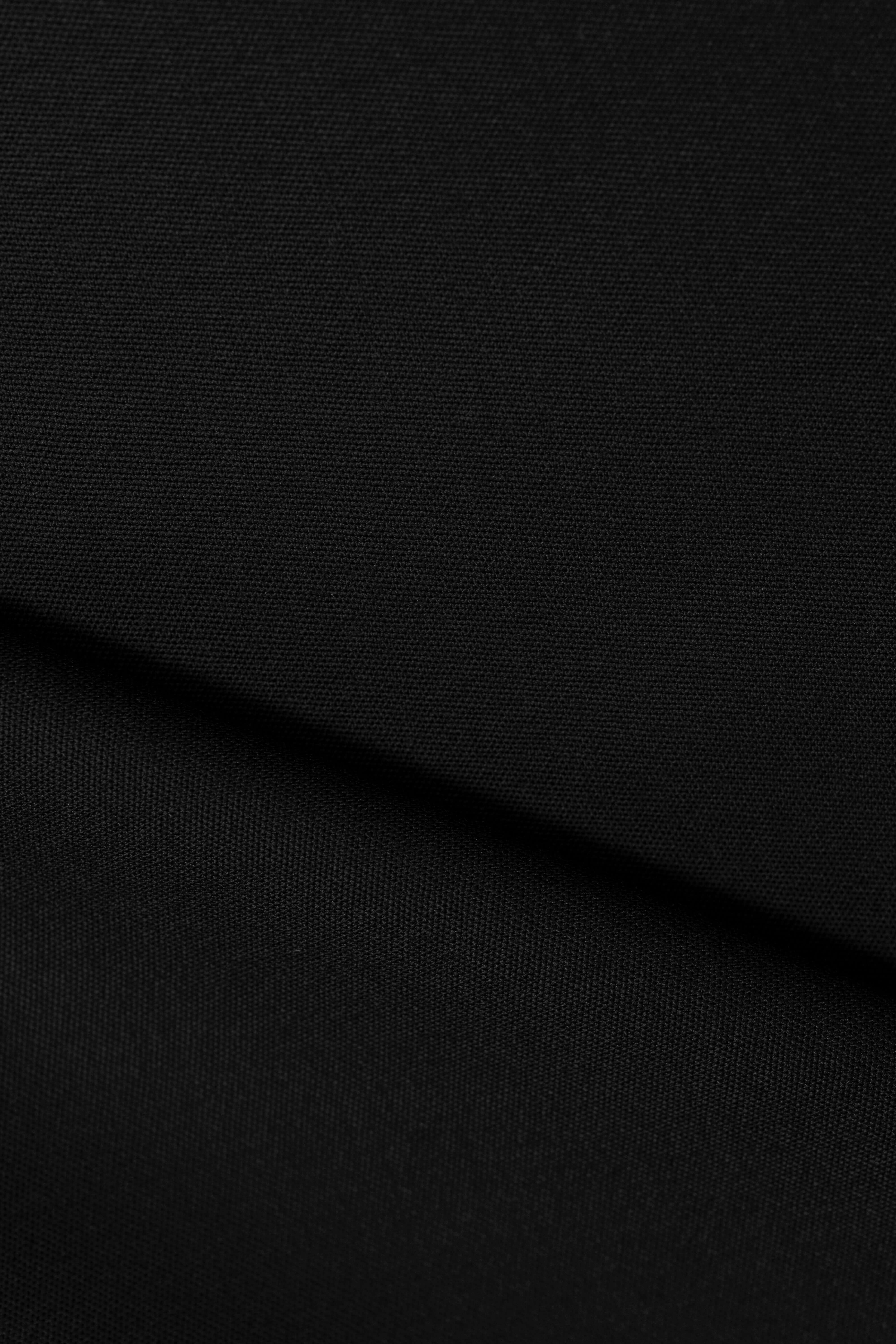 Groves & Lindley Super 120's worsted black wool suit fabric shown in a close-up view.