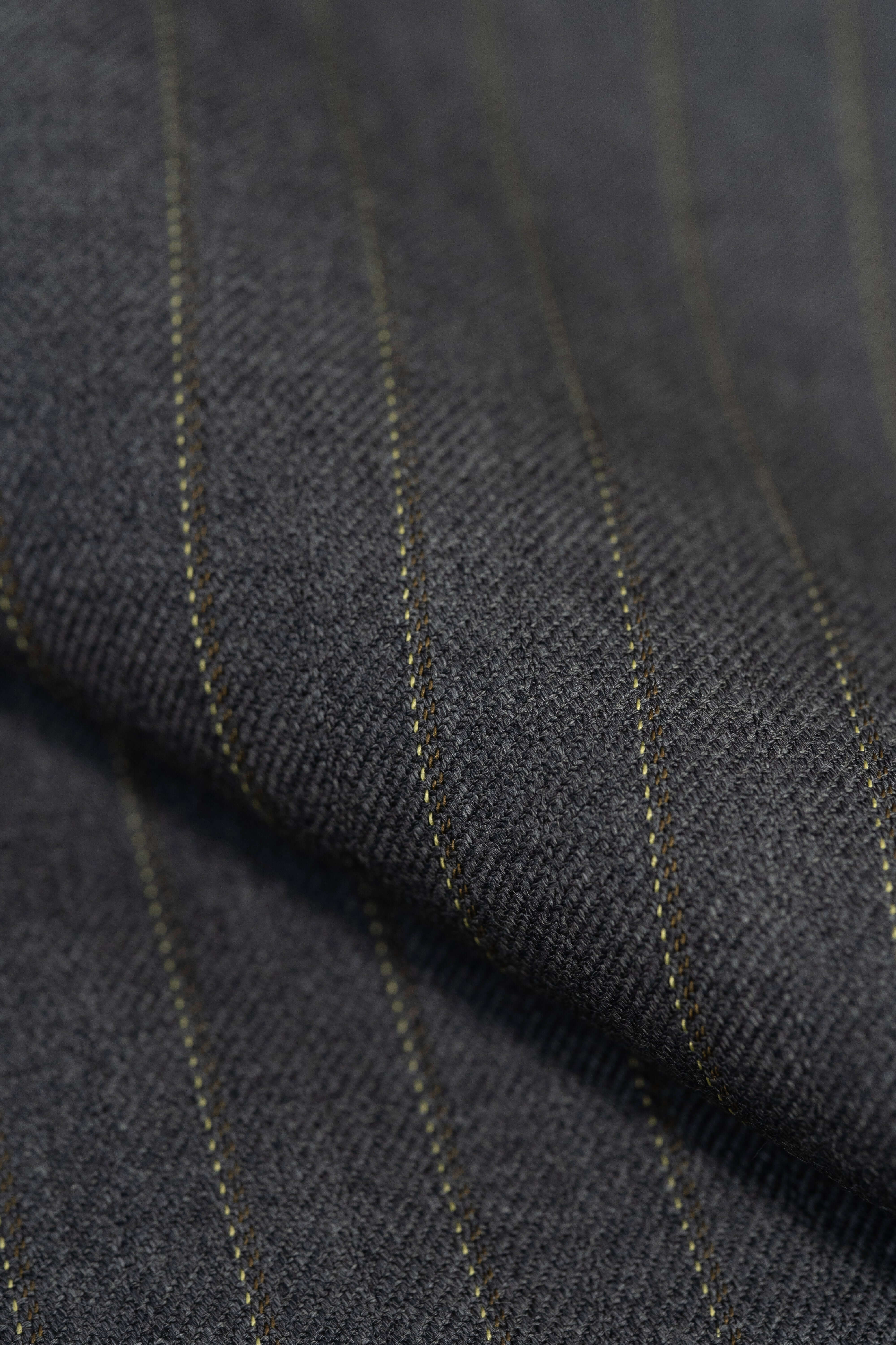 Close-up of Barrington Grey Super Merino Wool Suiting with yellow stripe - merino wool suiting fabric with yellow stripe.