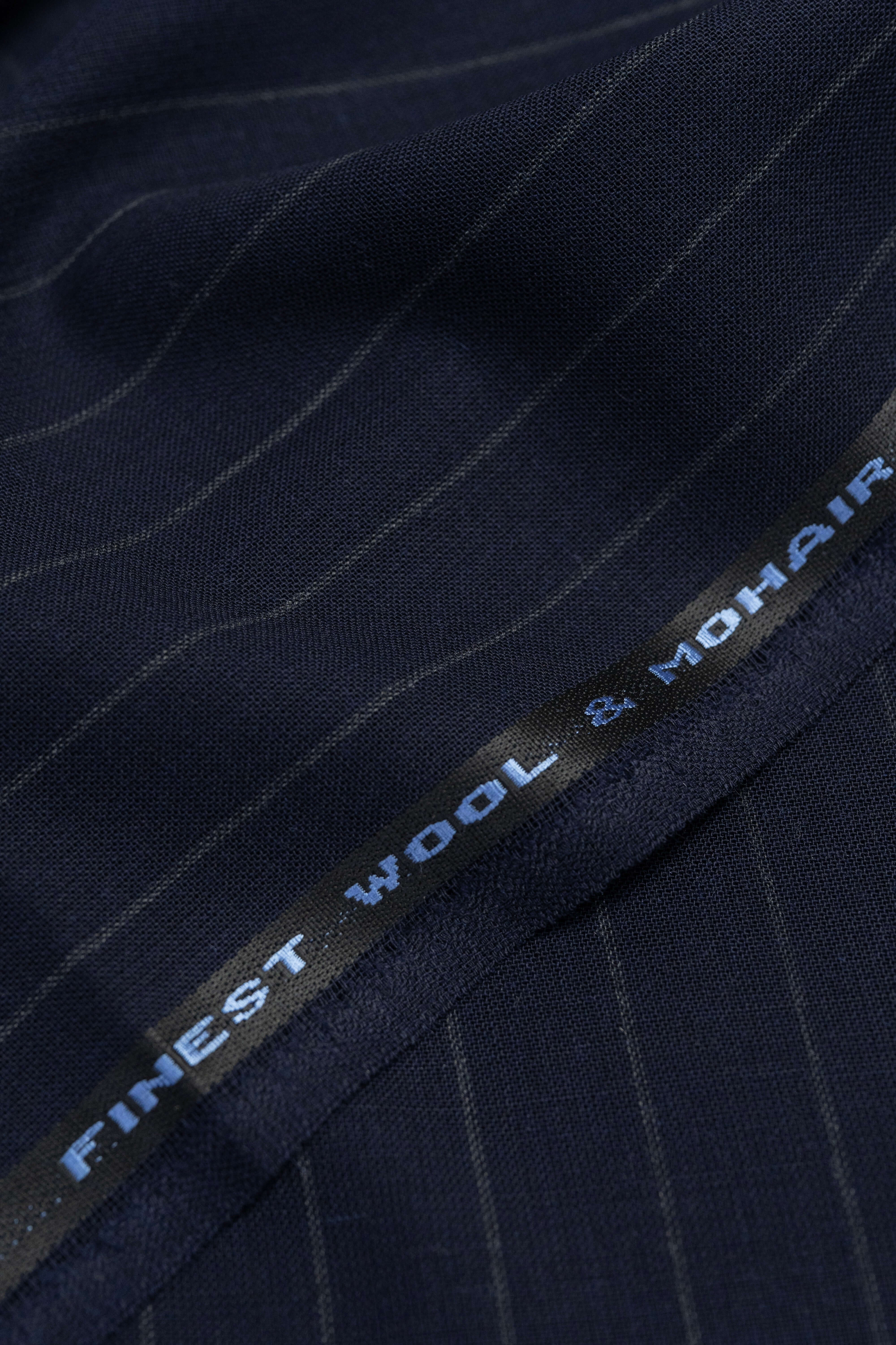 Close-up of Groves & Lindley dark blue stripe wool mohair suiting fabric showcasing finest wool & mohair quality.