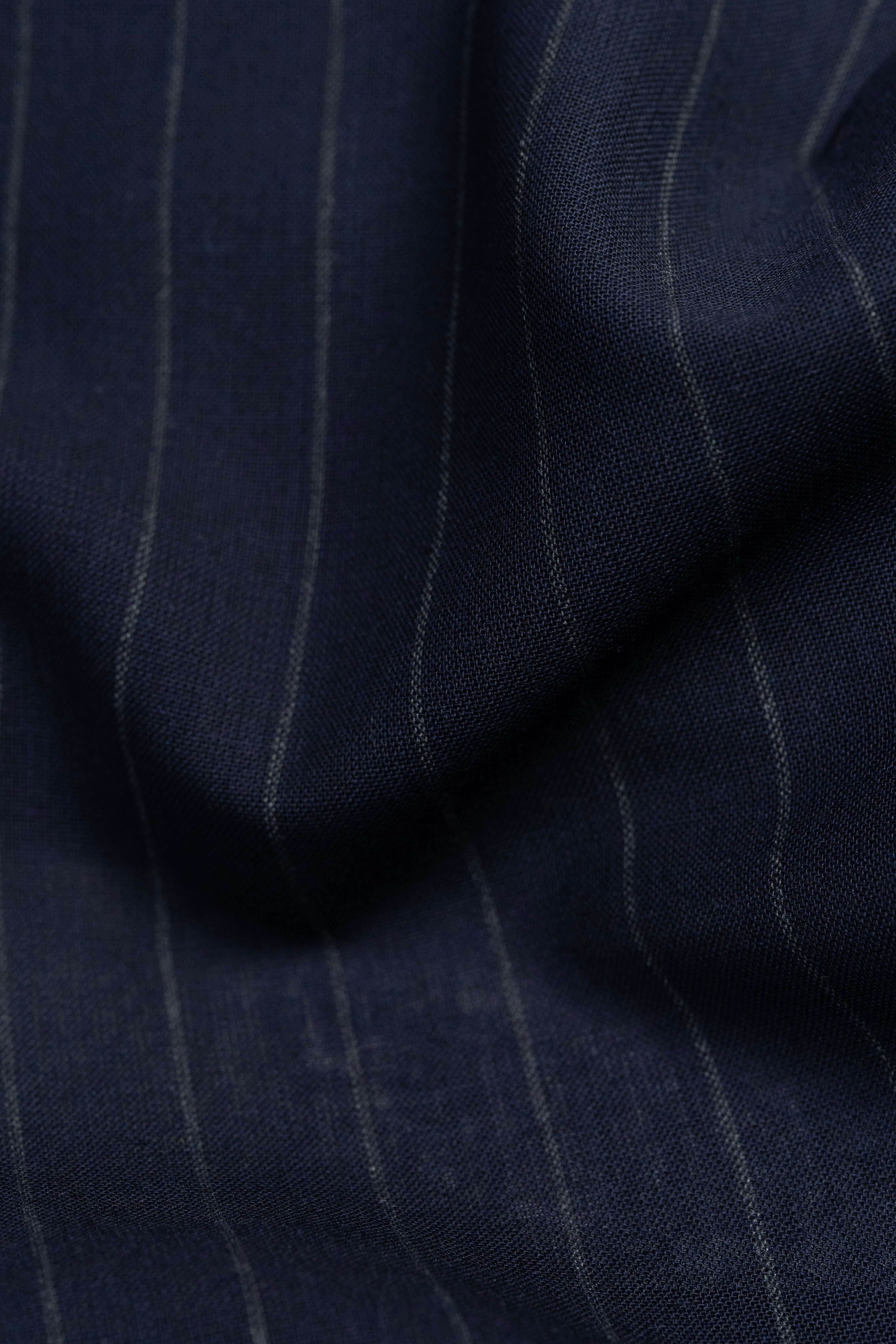 Dark blue stripe wool mohair suiting fabric close-up, showcasing fine stripes and texture.