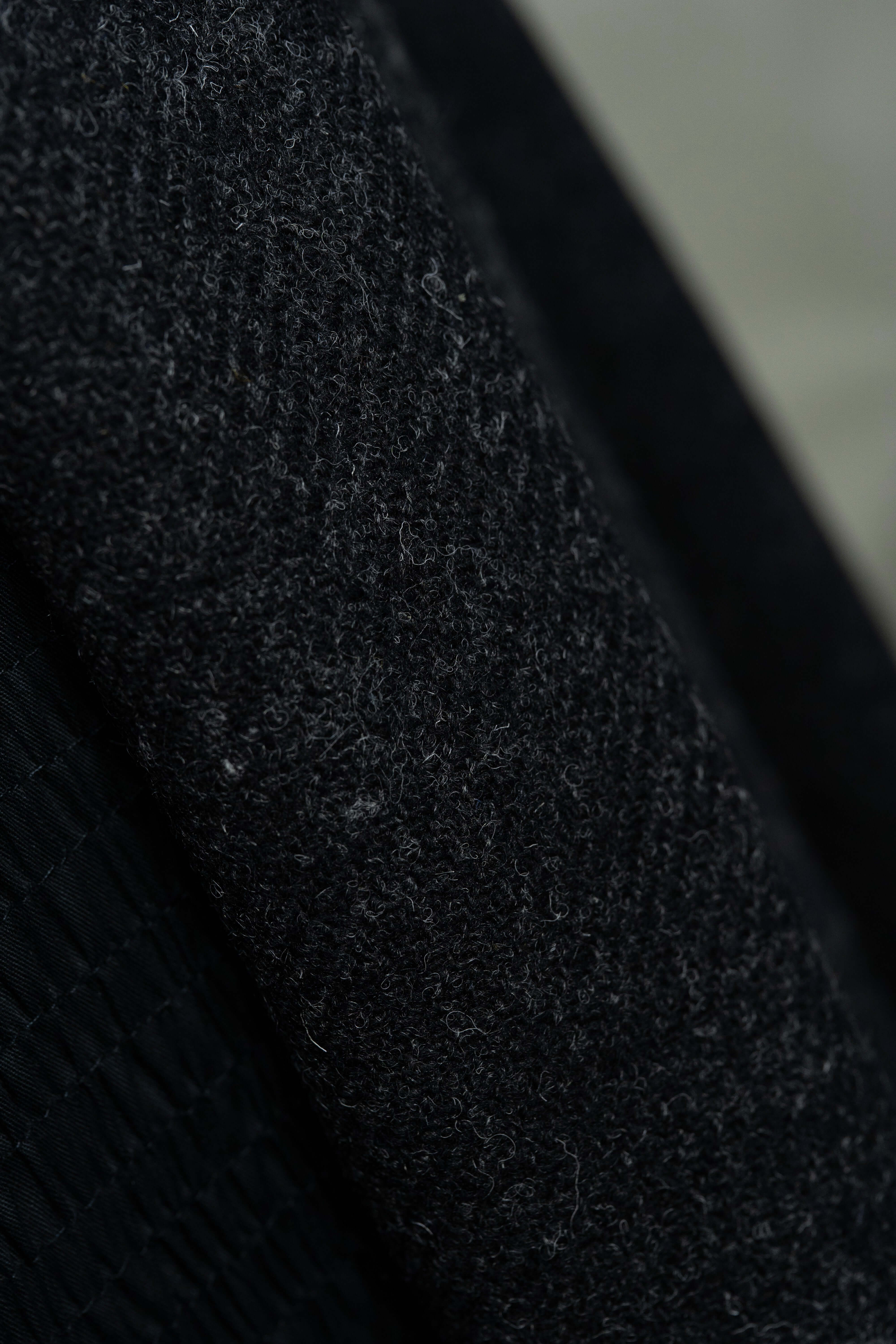 Dark Charcoal Heavy Woolen Fabric showcasing British Red Stripe Wool Suit Fabric patterns and texture.