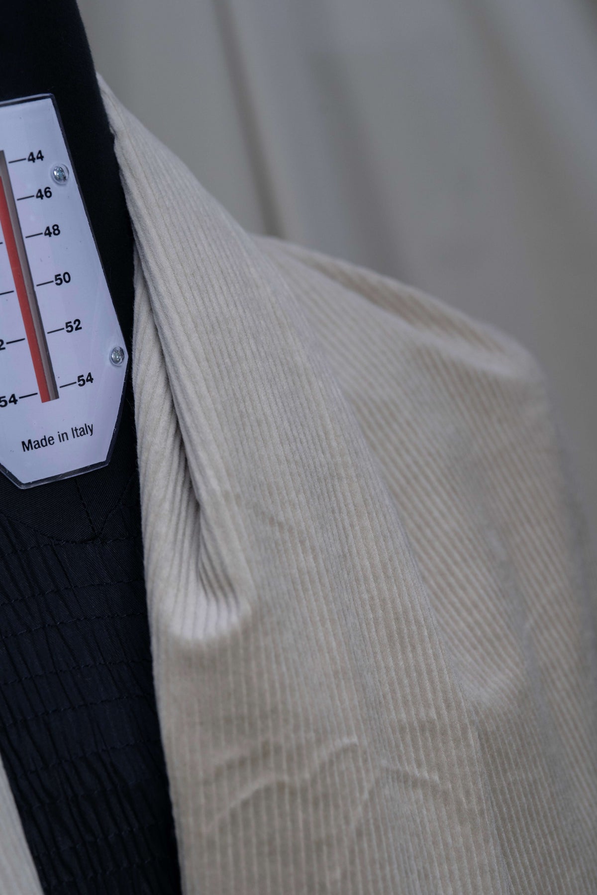 PONTOGLIO 1883 cotton cashmere corduroy suiting fabric draped on a mannequin, showcasing its texture.