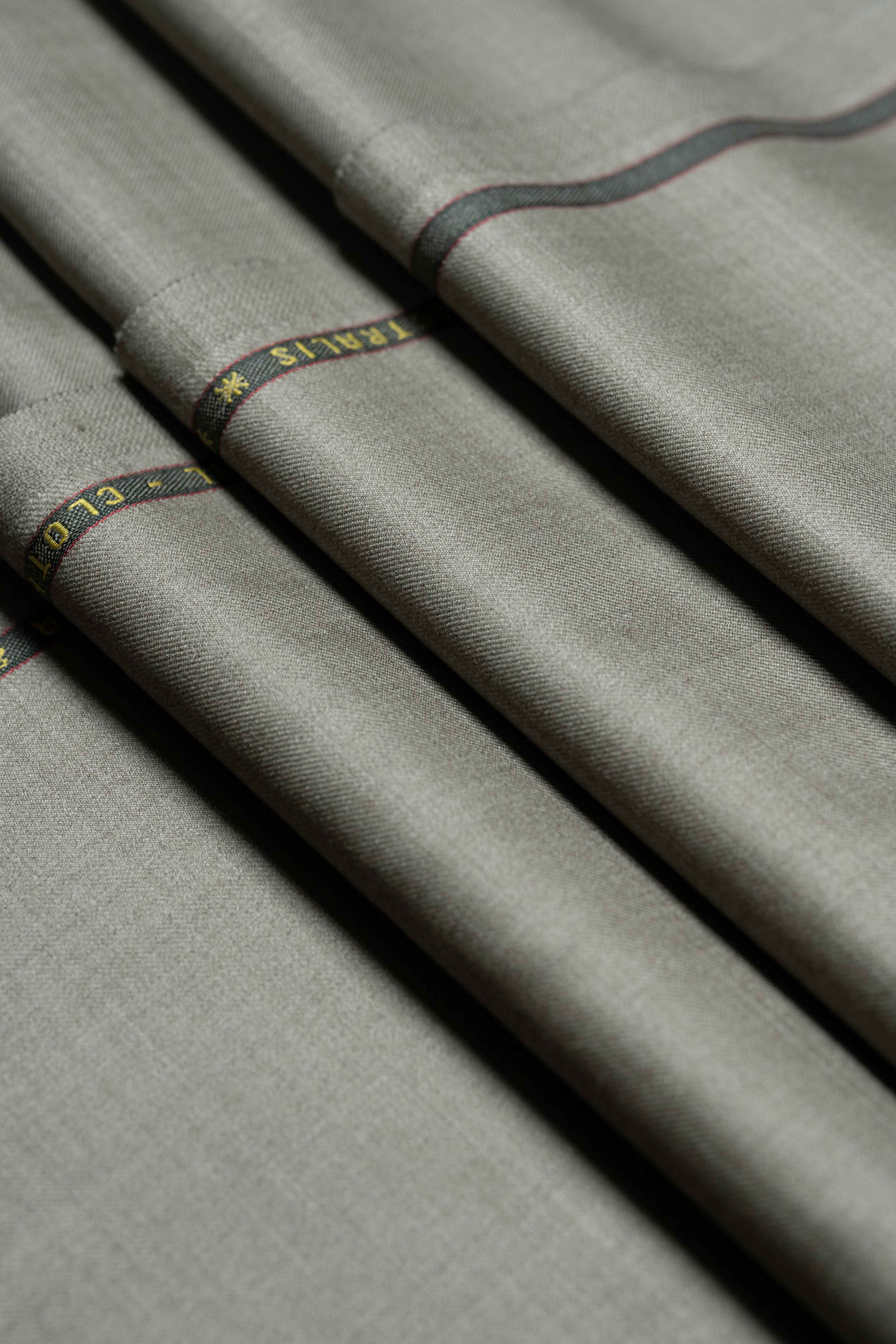 Loro Piana taupe Australian 150's merino wool suit fabric, showcasing a smooth texture and elegant color.