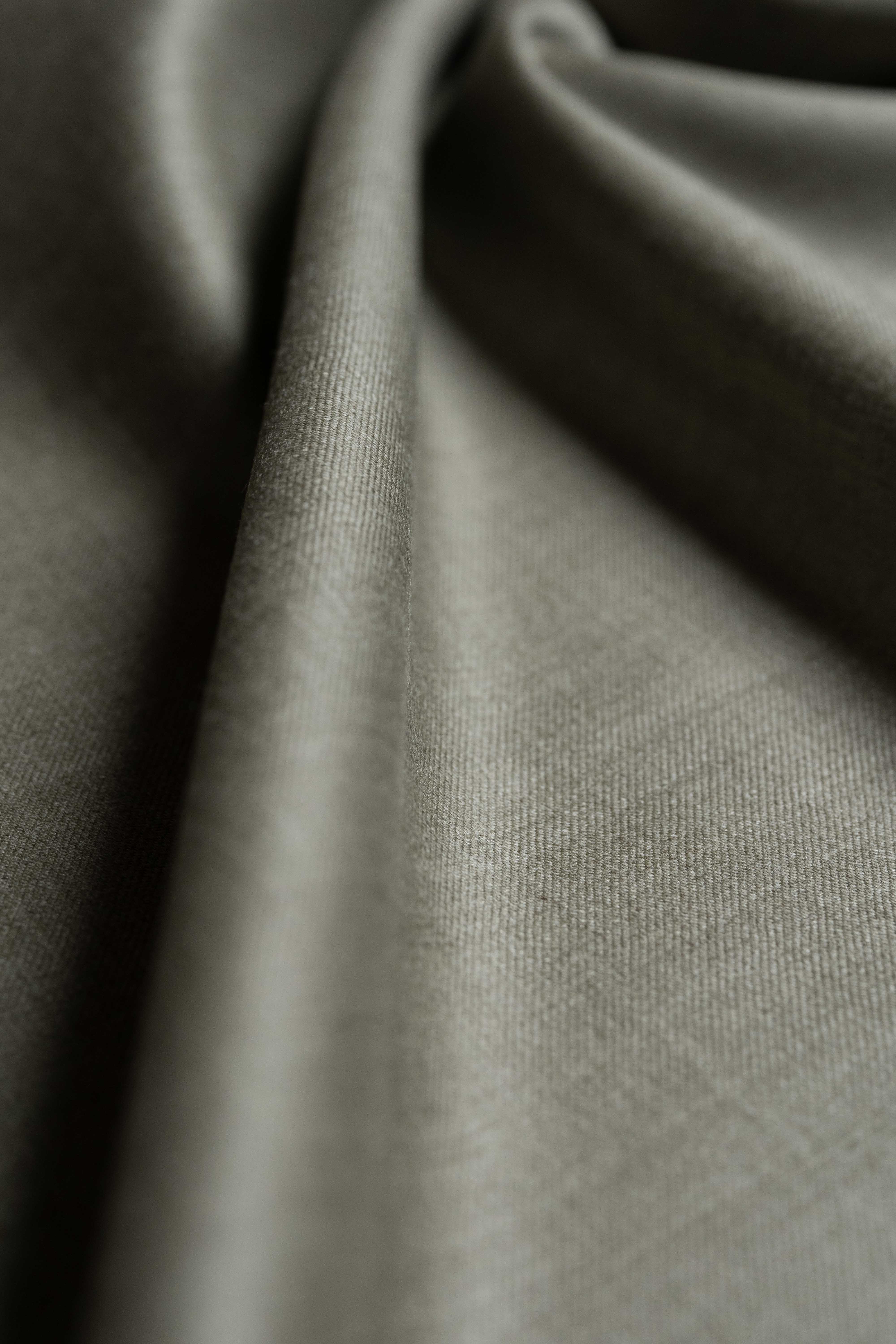 Loro Piana taupe Australian 150's merino wool suit fabric showcasing smooth texture and elegant color.