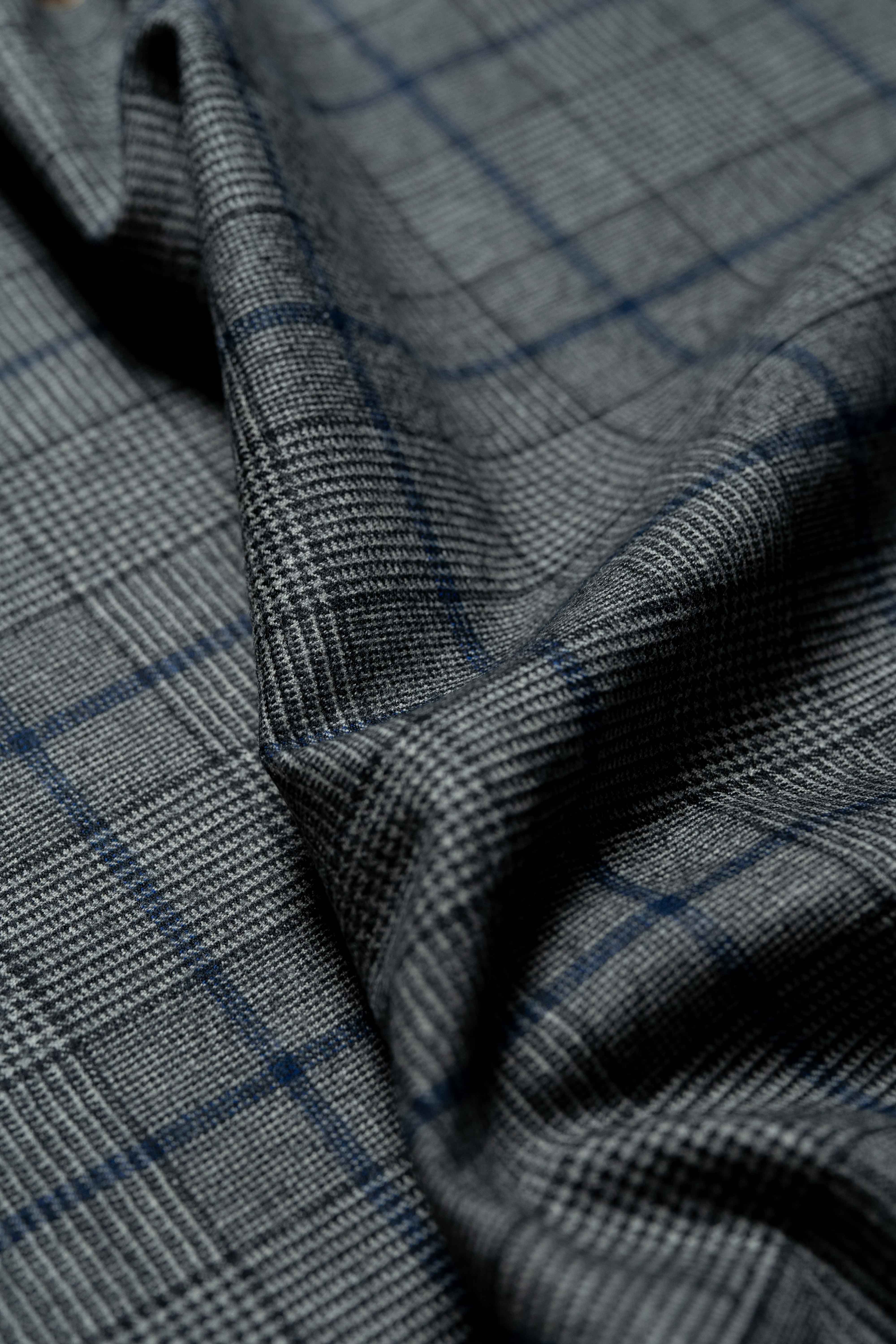 Fratelli Tallia Di Delfino blue Glen Plaid 130's flannel fabric texture close-up, showcasing luxurious wool quality.