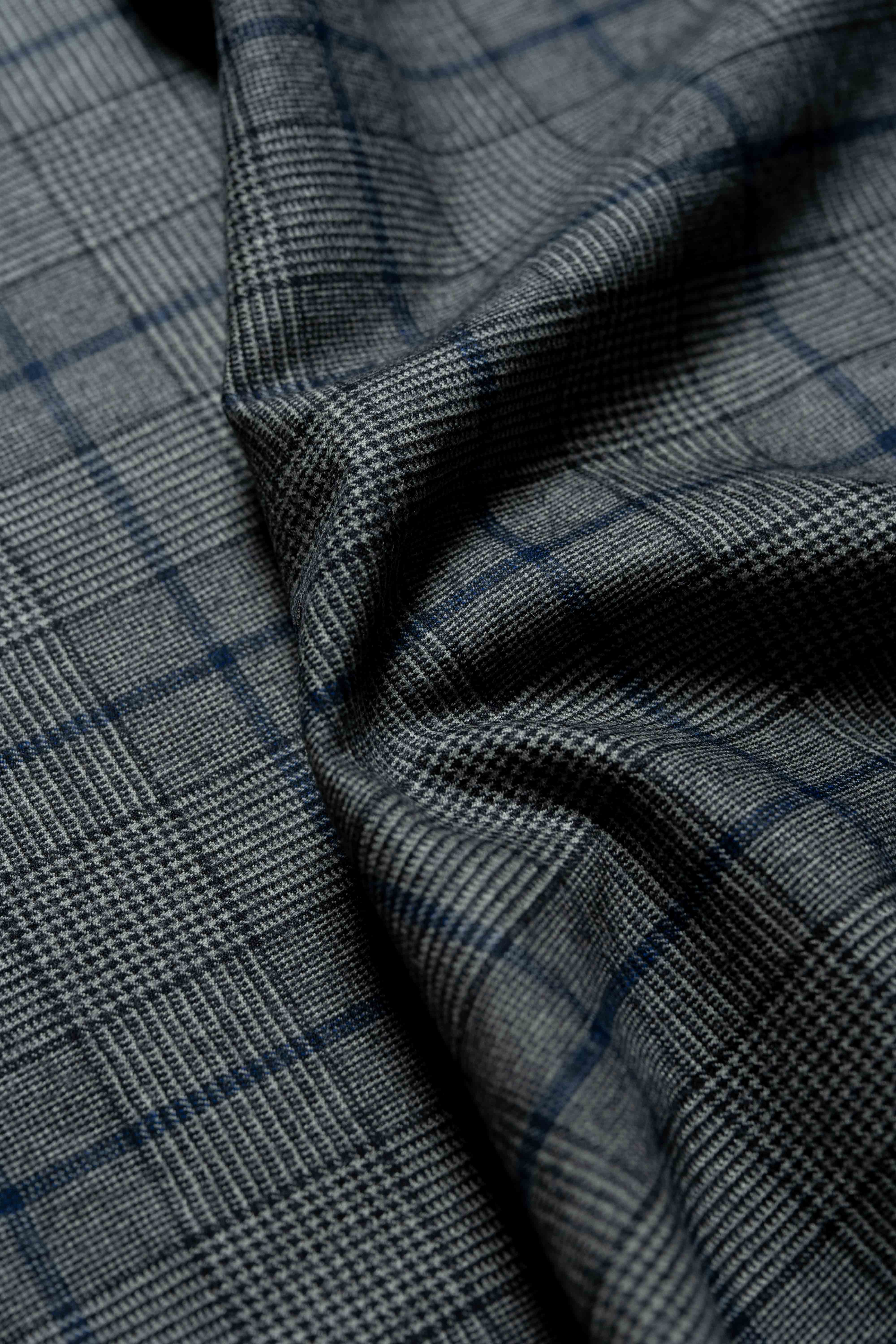 Fratelli Tallia Di Delfino blue Glen Plaid fabric showcasing luxurious texture and pattern details in wool flannel.
