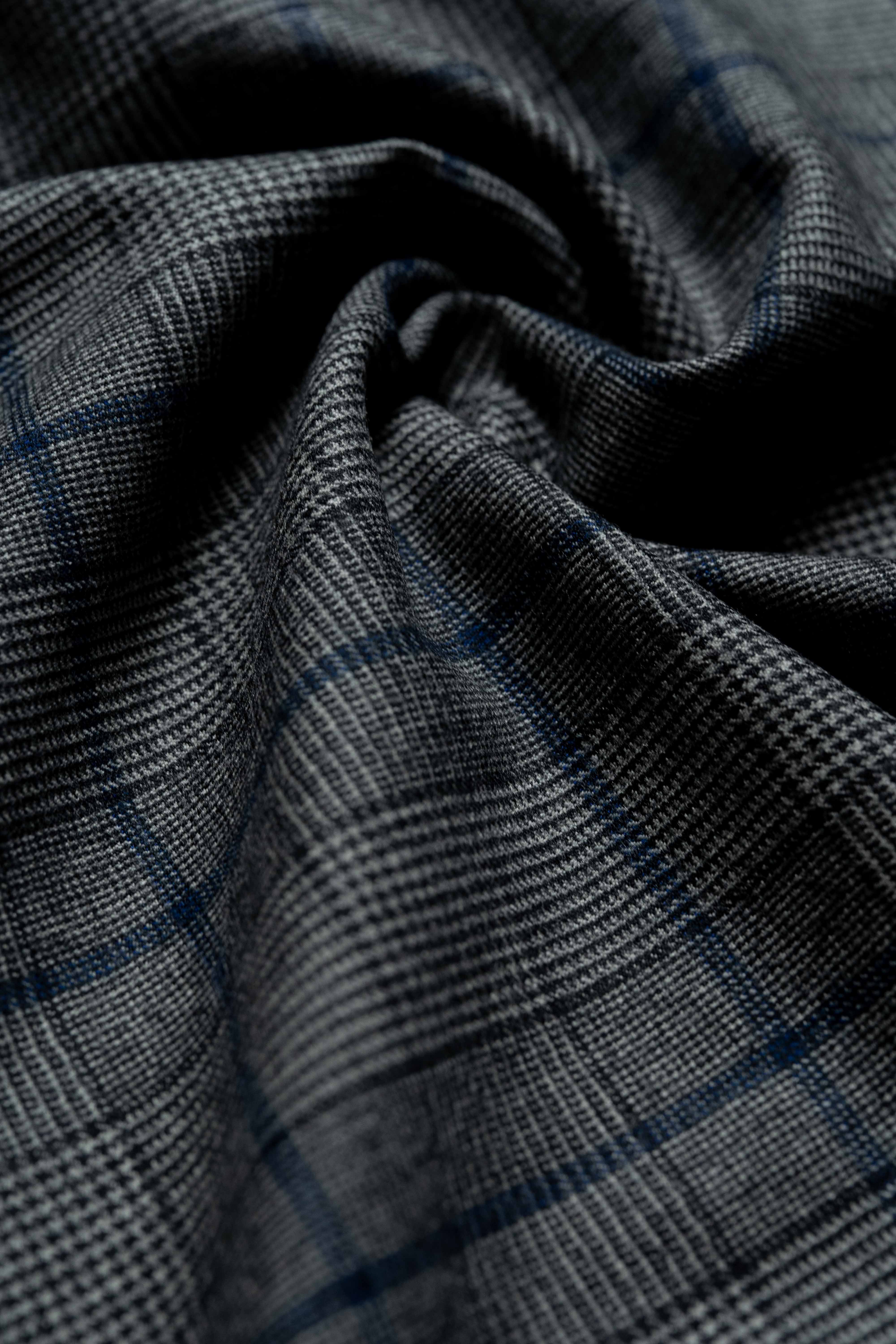 Fratelli Tallia Di Delfino blue Glen Plaid fabric showcasing luxurious Super 130's wool flannel craftsmanship.