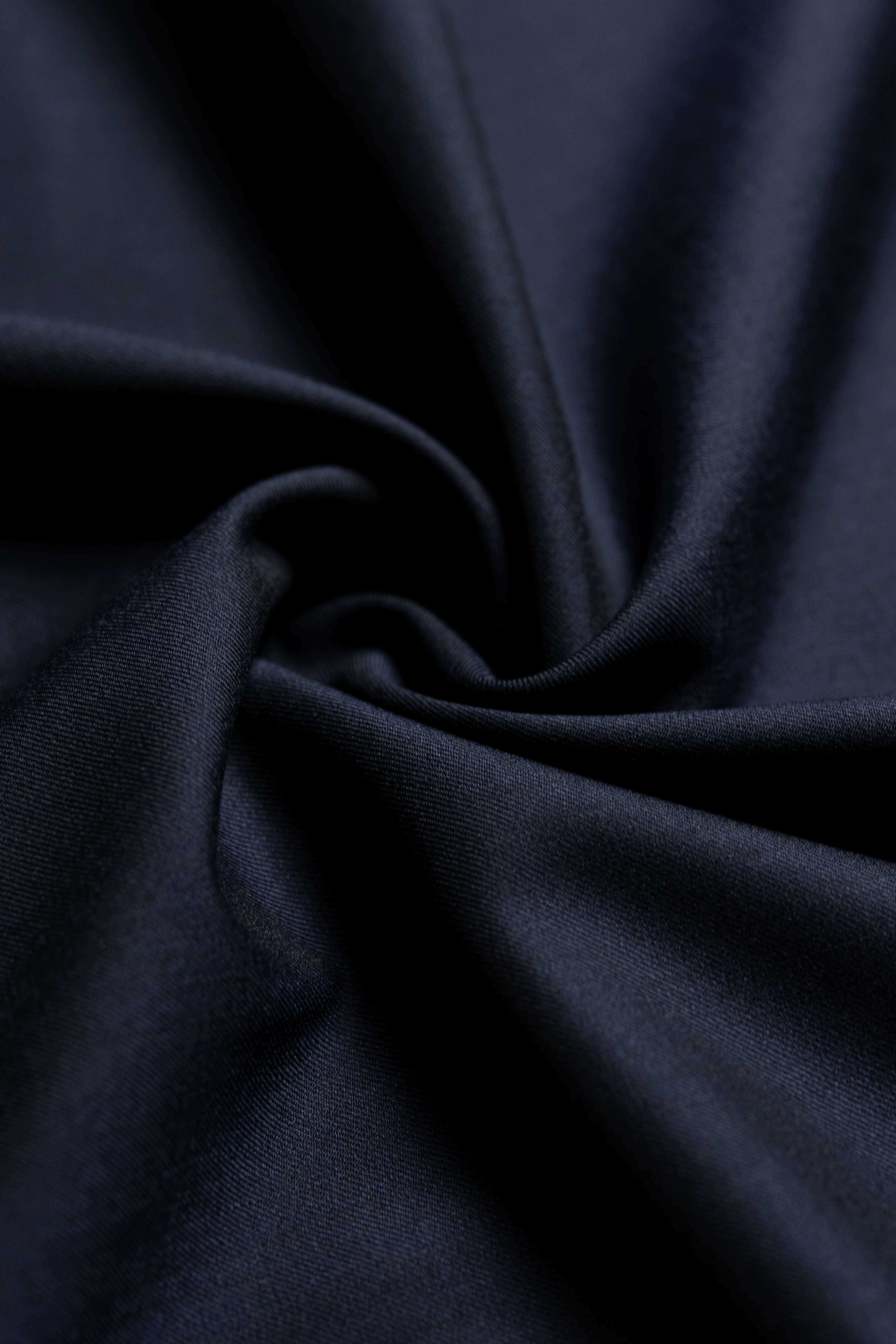 Loro Piana Midnight Navy Tasmanian 150's wool and silk fabric close-up showing luxurious texture.