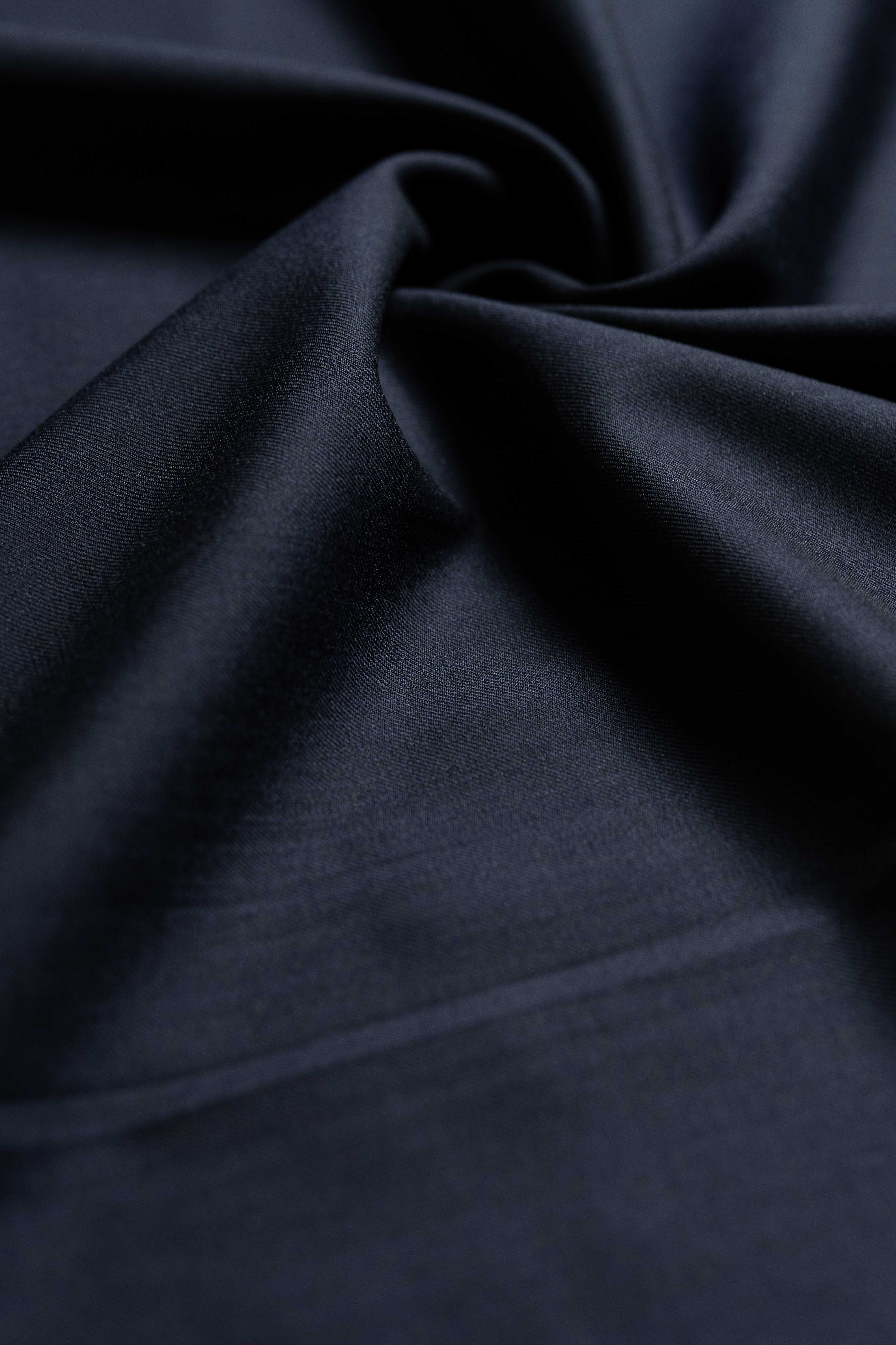 Loro Piana Midnight Navy Tasmanian 150's Wool & Silk fabric showcasing rich texture and elegant sheen.