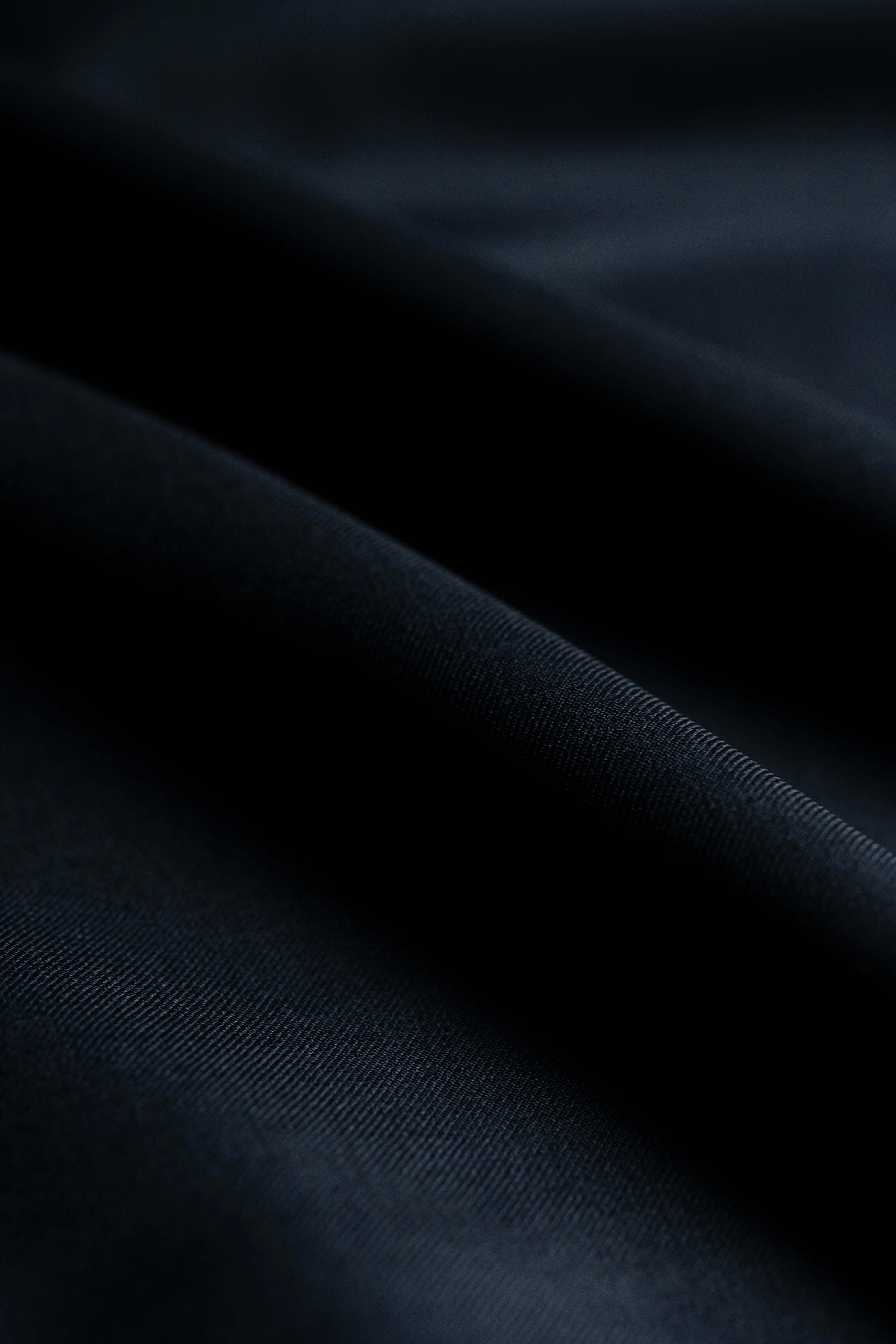 Close-up of Loro Piana Dark Navy Tasmanian 150's Wool suit fabric showcasing its luxurious texture.