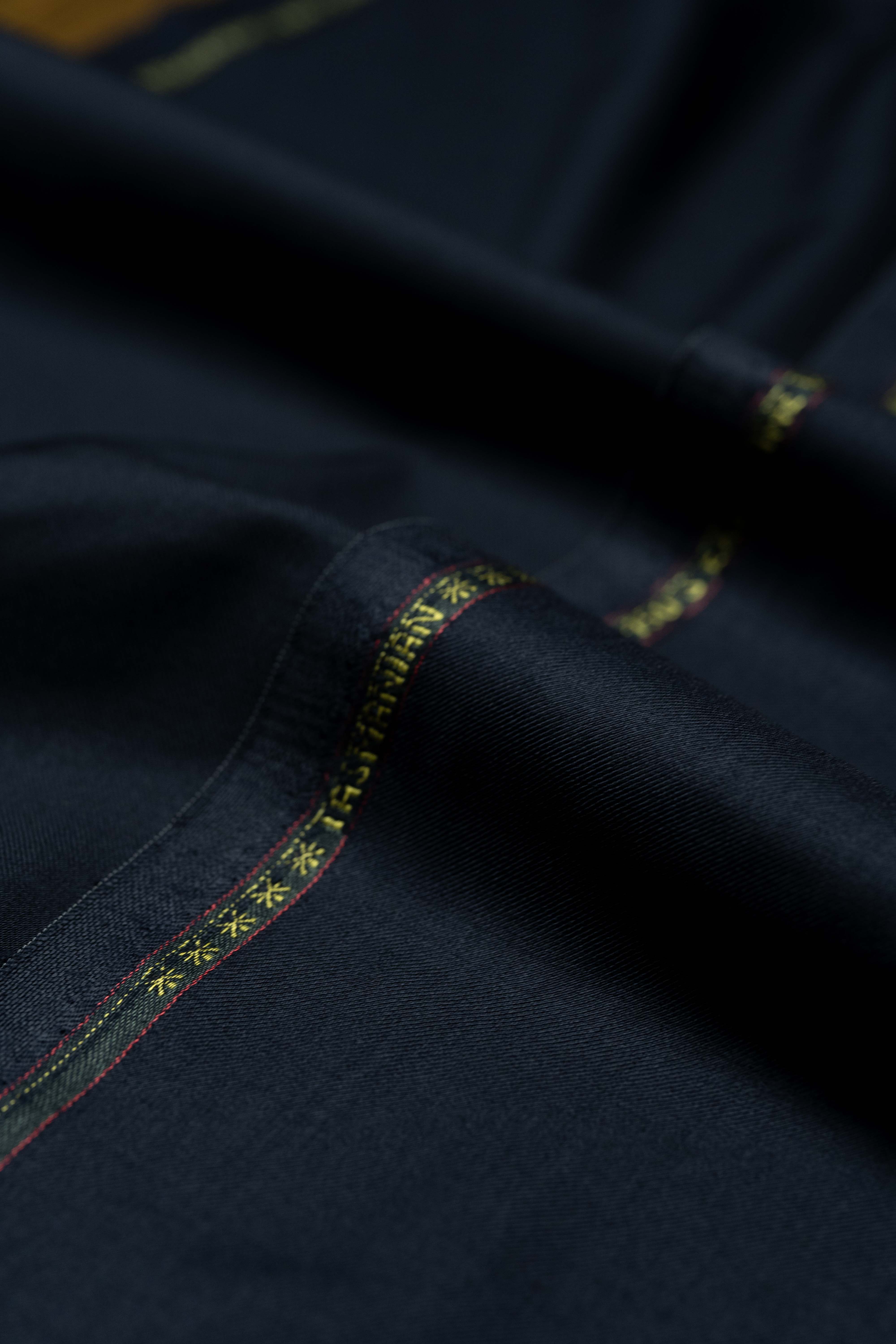 Loro Piana Dark Navy Tasmanian 150's Wool Suit Fabric with intricate detailing.