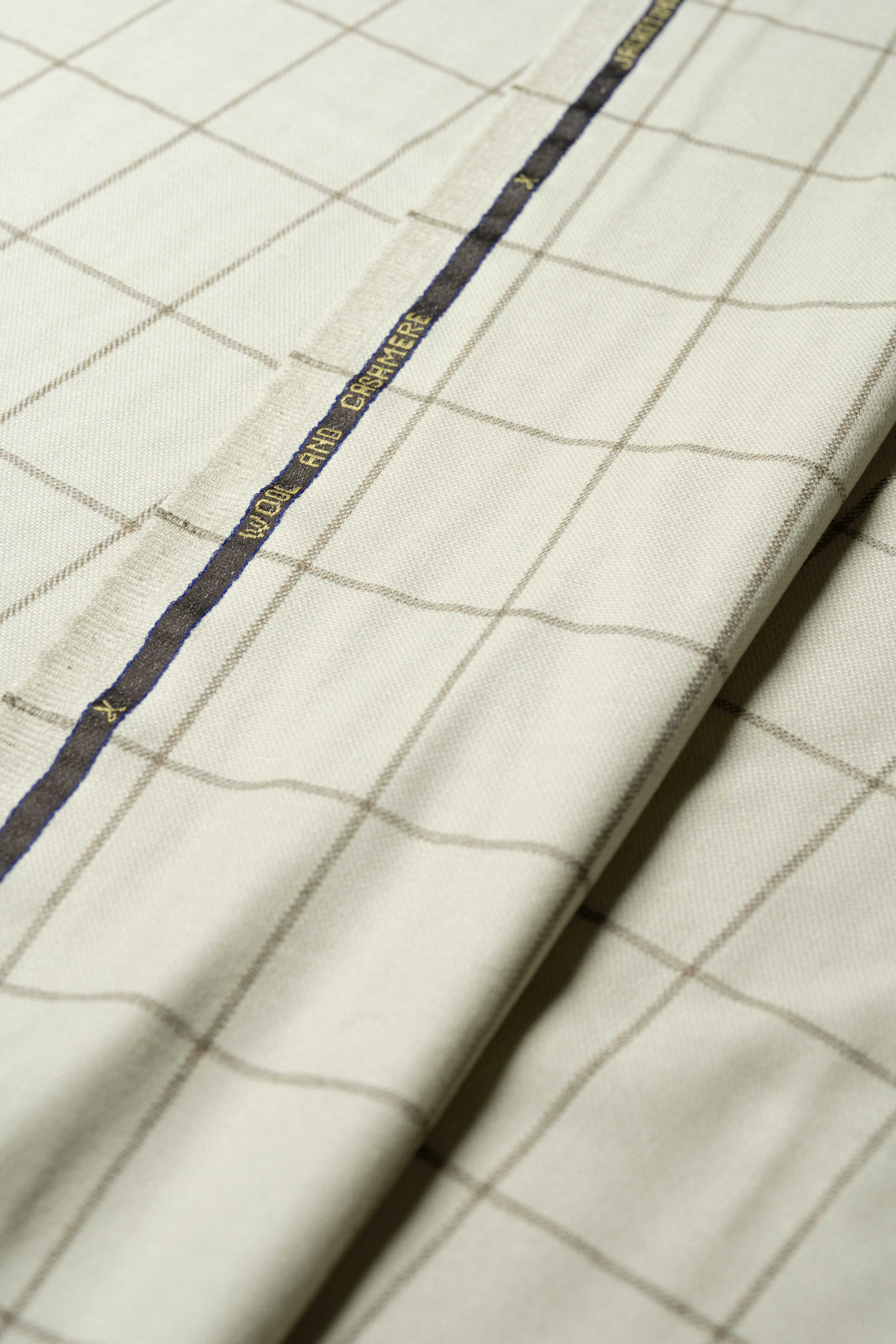 VBC Beige Check Wool & Cashmere Jacketing fabric showcasing its luxurious texture and timeless design.