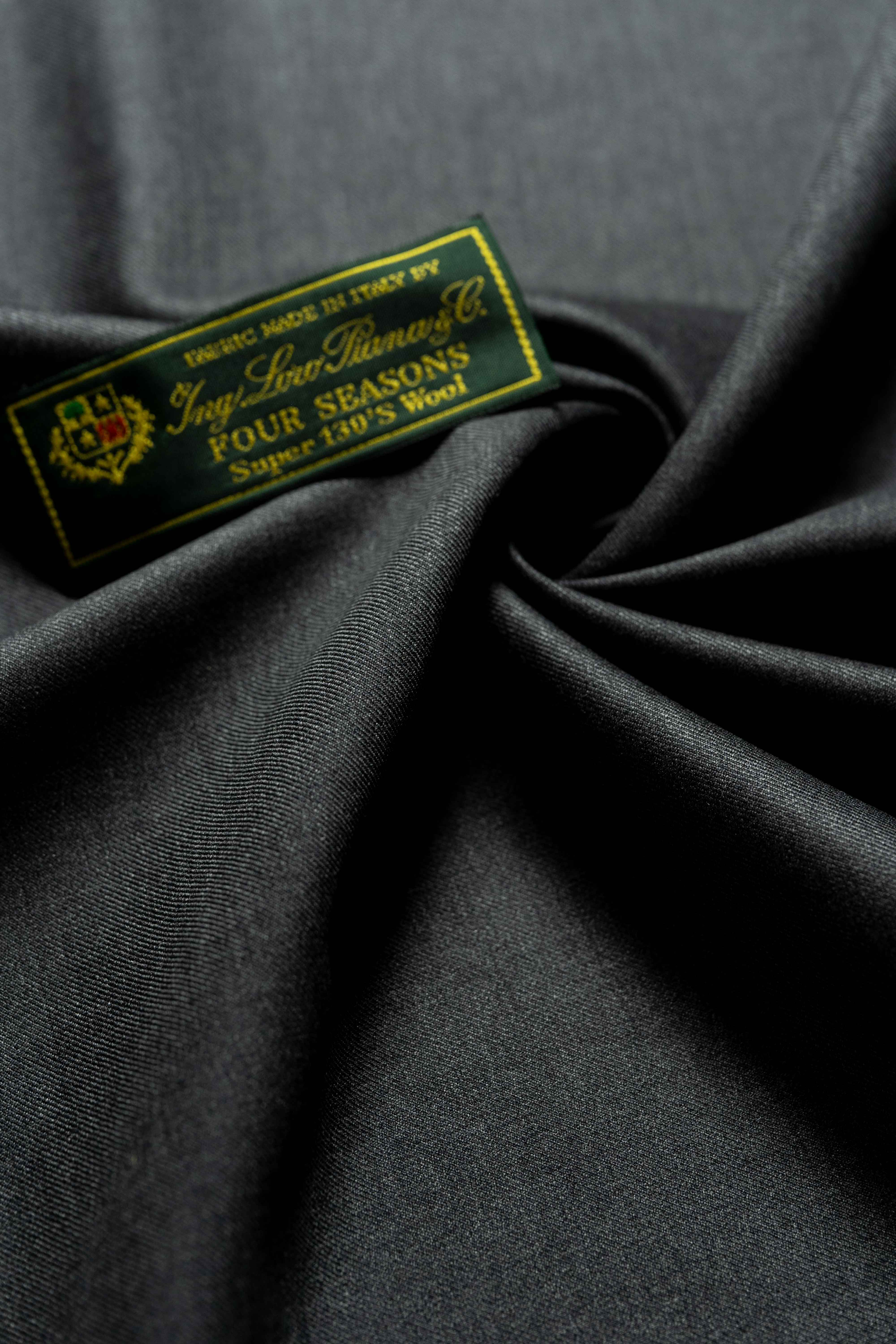 Loro Piana Charcoal 130's Merino Wool Suit Fabric showcasing luxurious texture and quality craftsmanship.
