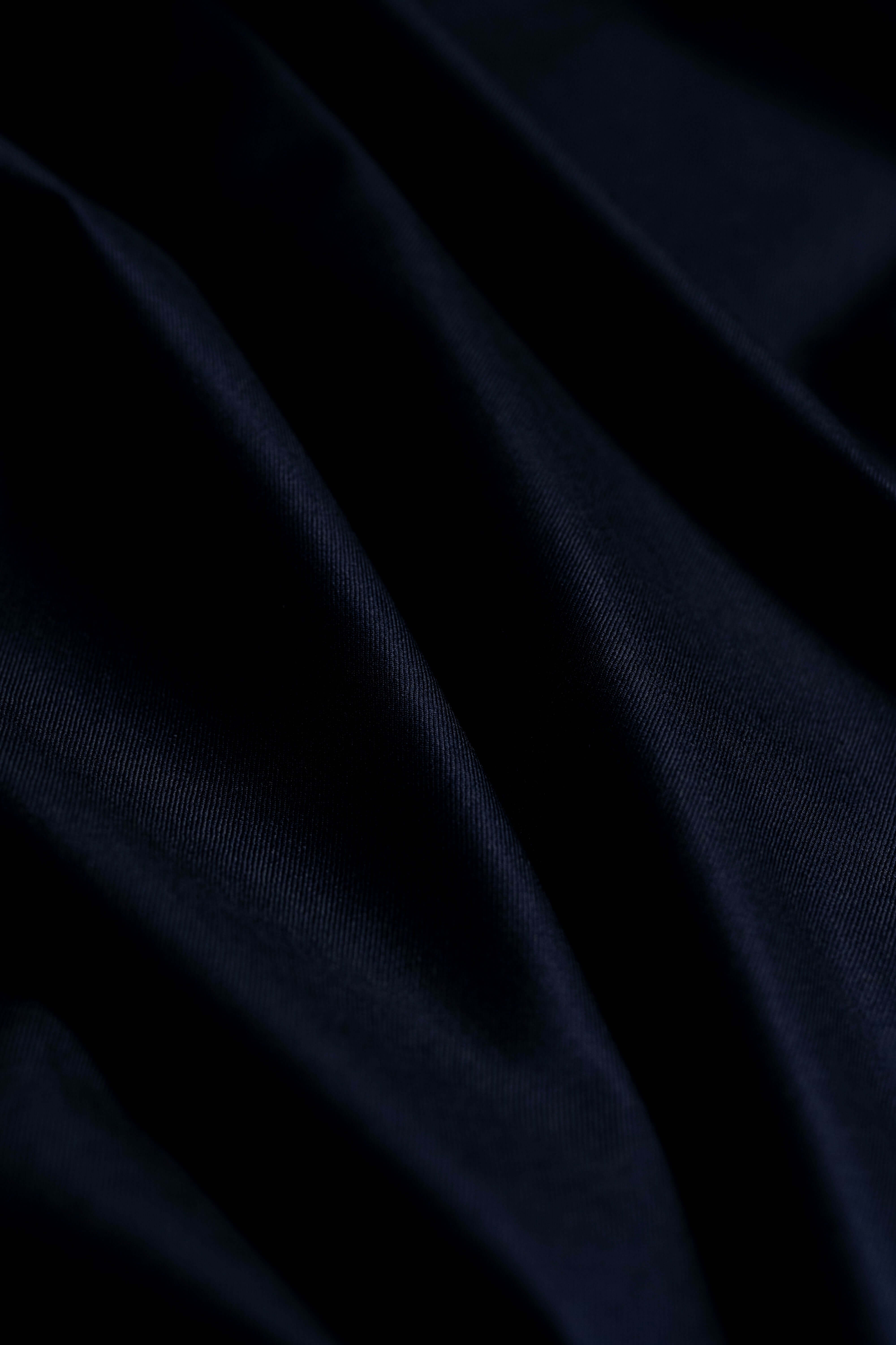 Loro Piana Dark Navy 150's Merino wool suit fabric showcasing its luxurious texture and refined color.