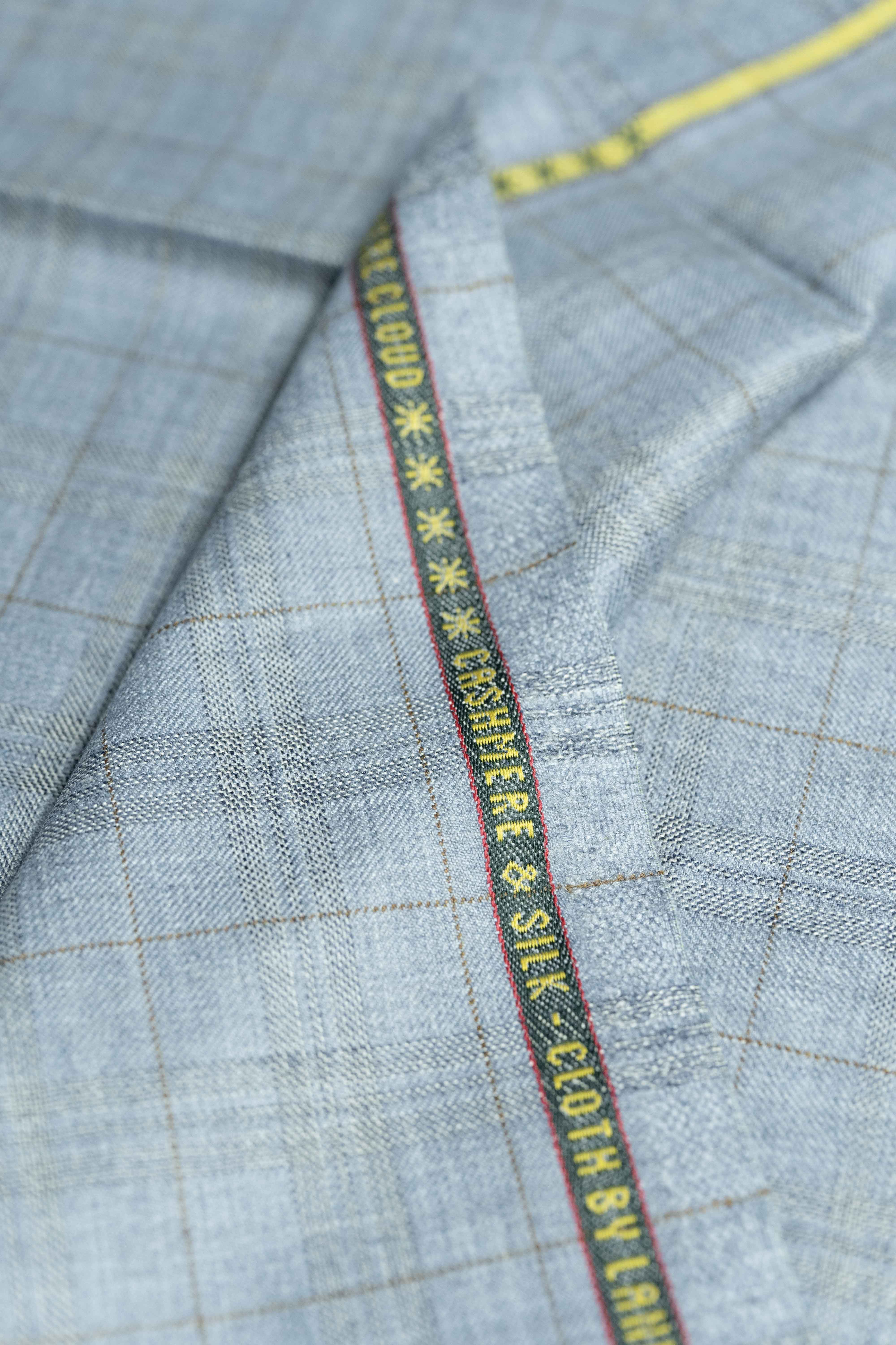 Loro Piana Light Blue Cashmere Silk fabric showcasing luxurious texture and intricate detailing.