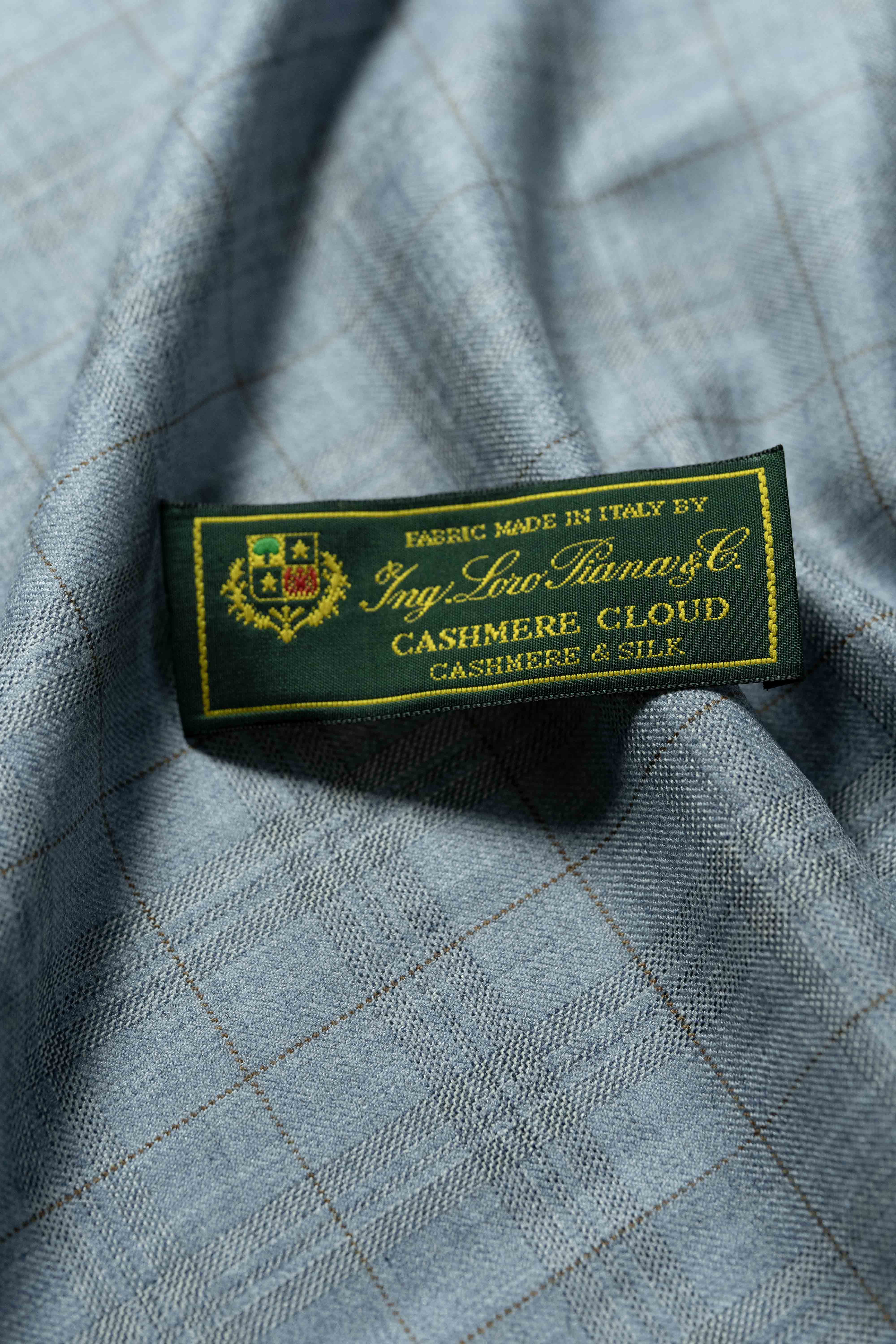 Loro Piana Light Blue Cashmere Silk fabric label showing luxurious textile craftsmanship from Italy.