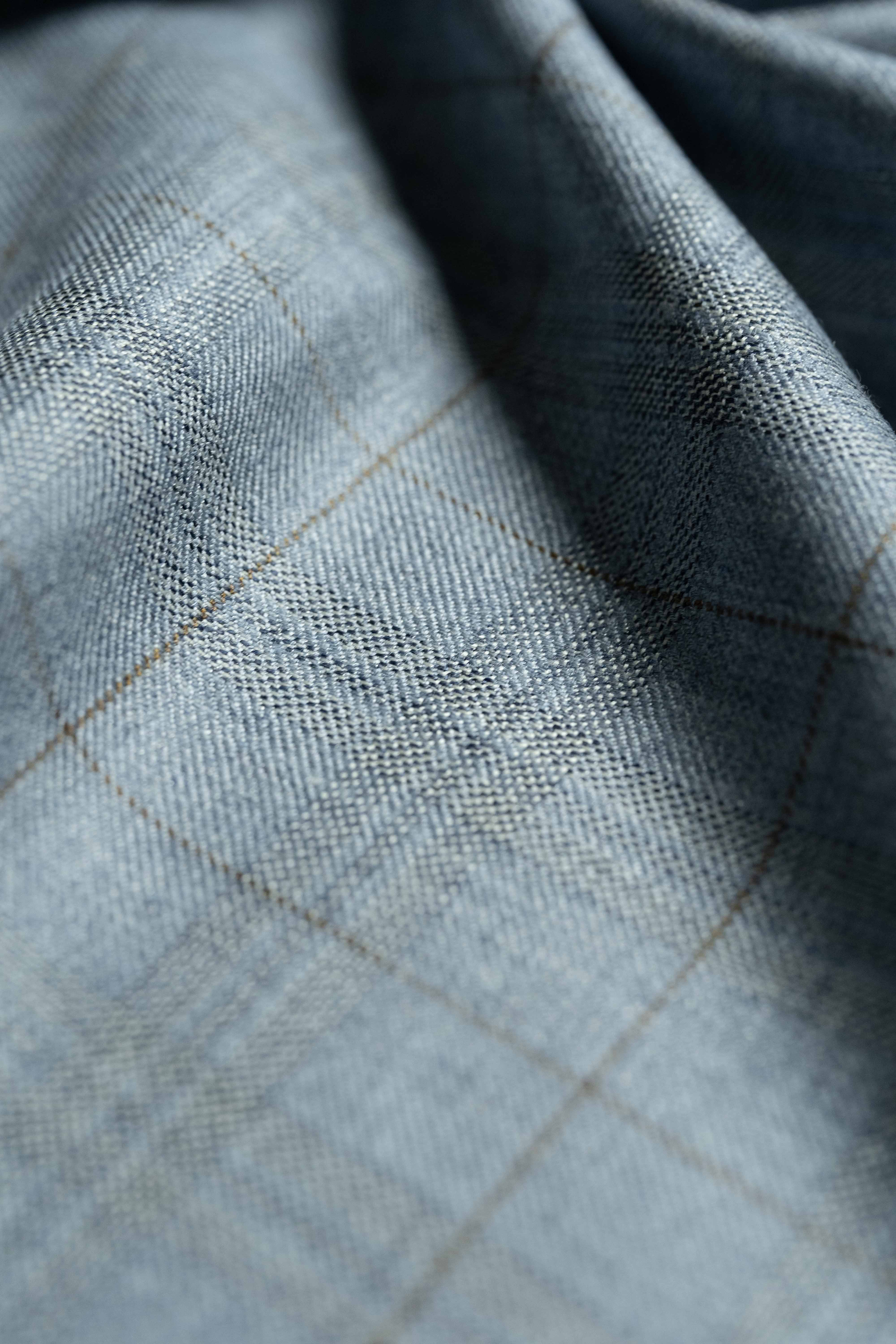 Loro Piana Light Blue Cashmere Silk Jacket Fabric close-up texture with elegant pattern.