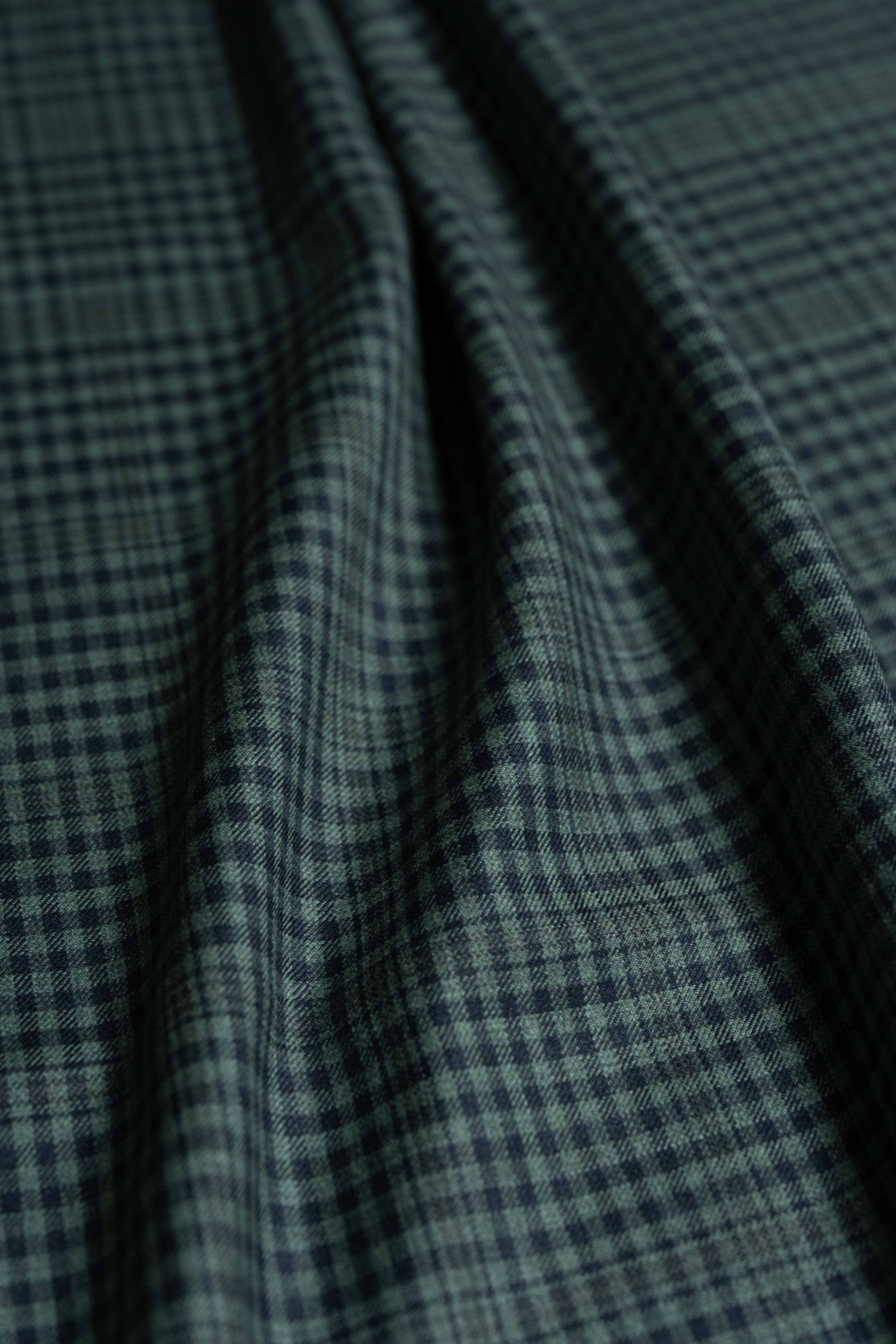 Loro Piana dark teal wool jacket fabric with a refined check pattern, ideal for luxury tailoring.