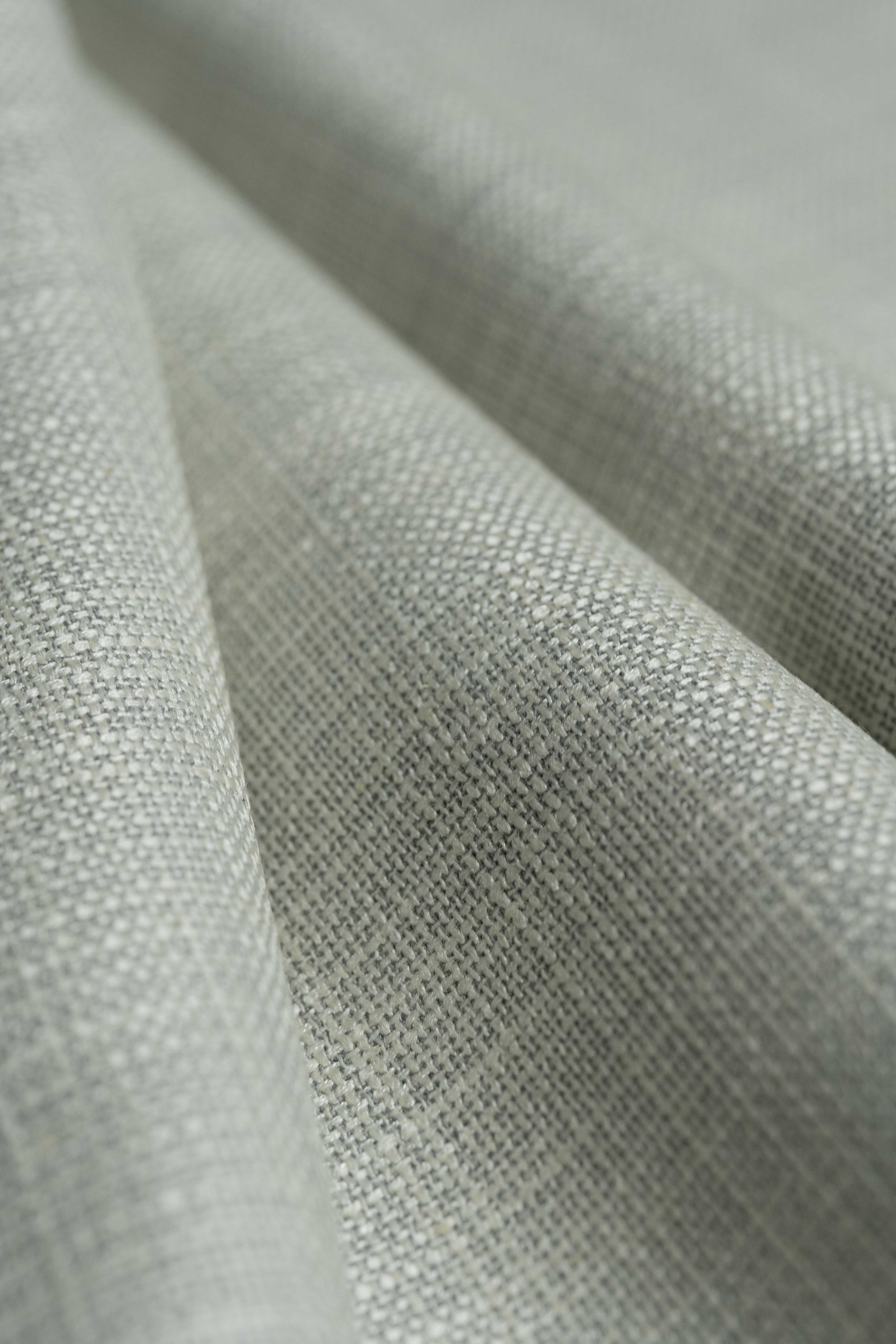 Loro Piana Beige Wool Silk Linen Jacket Fabric showcasing a textured surface with soft folds and elegant colors.