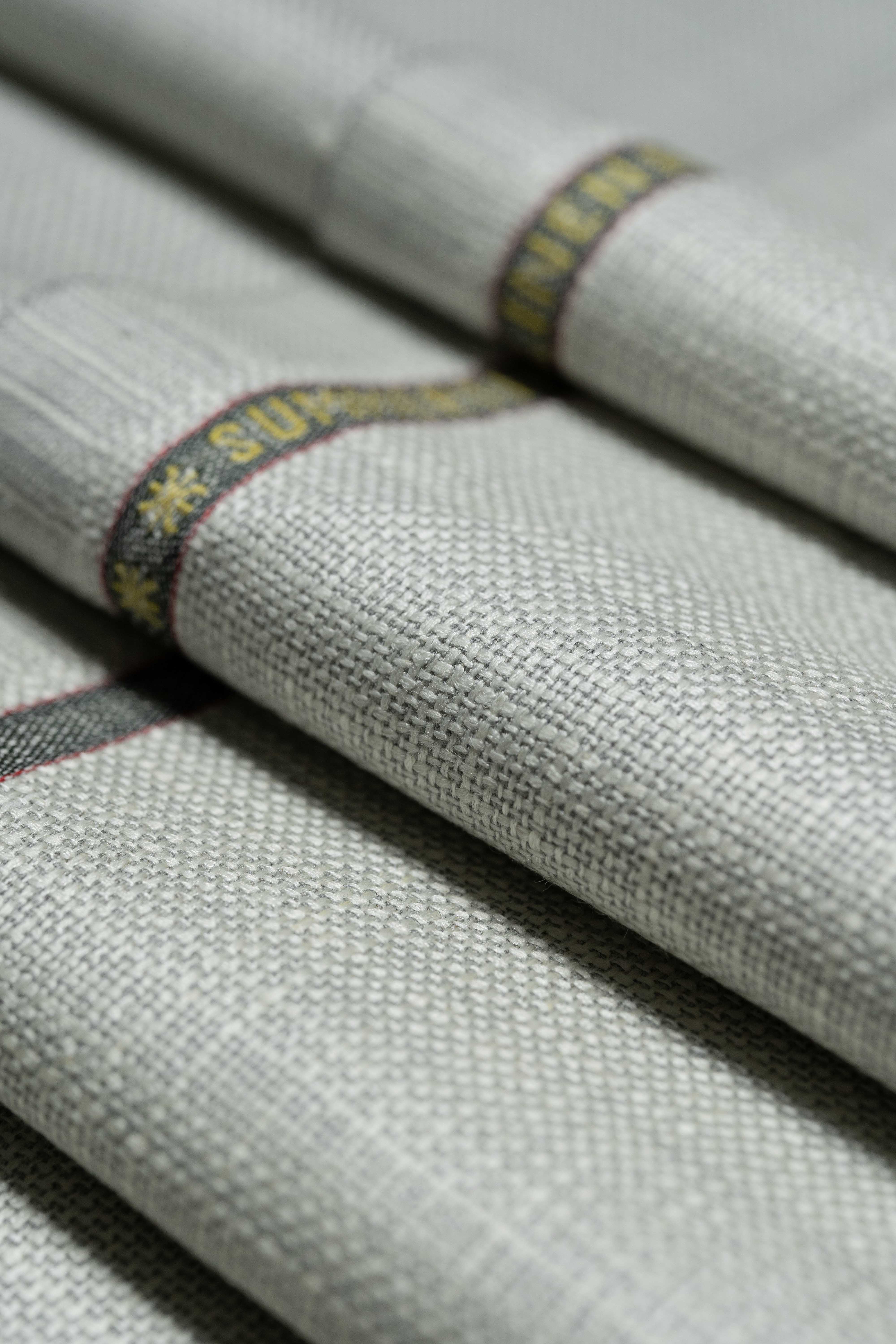Loro Piana Beige Wool Silk Linen Jacket Fabric showcasing luxurious texture and quality craftsmanship.