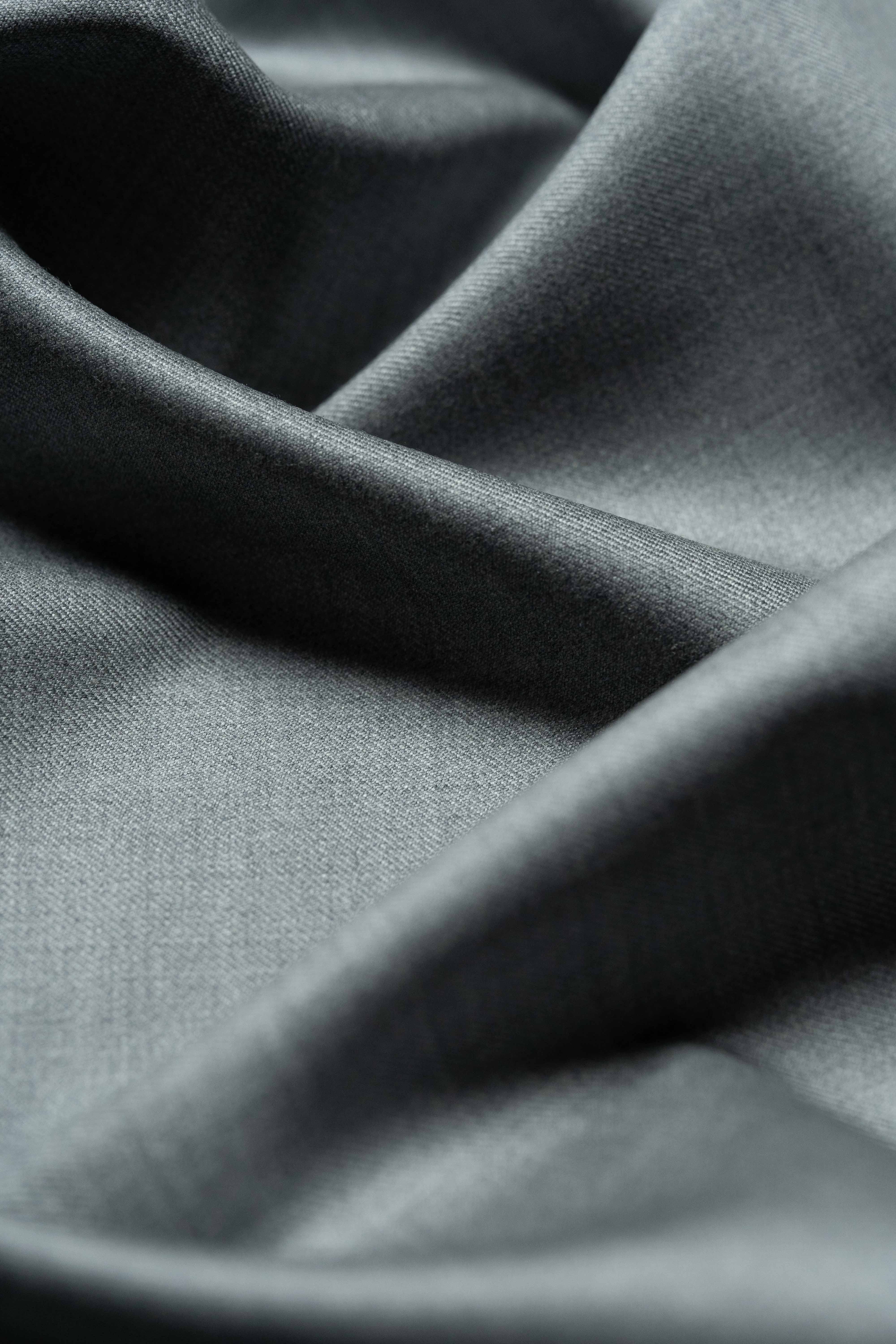 Loro Piana Grey Australis 150's Merino Wool Suit Fabric close-up texture, showcasing luxurious drape and quality.