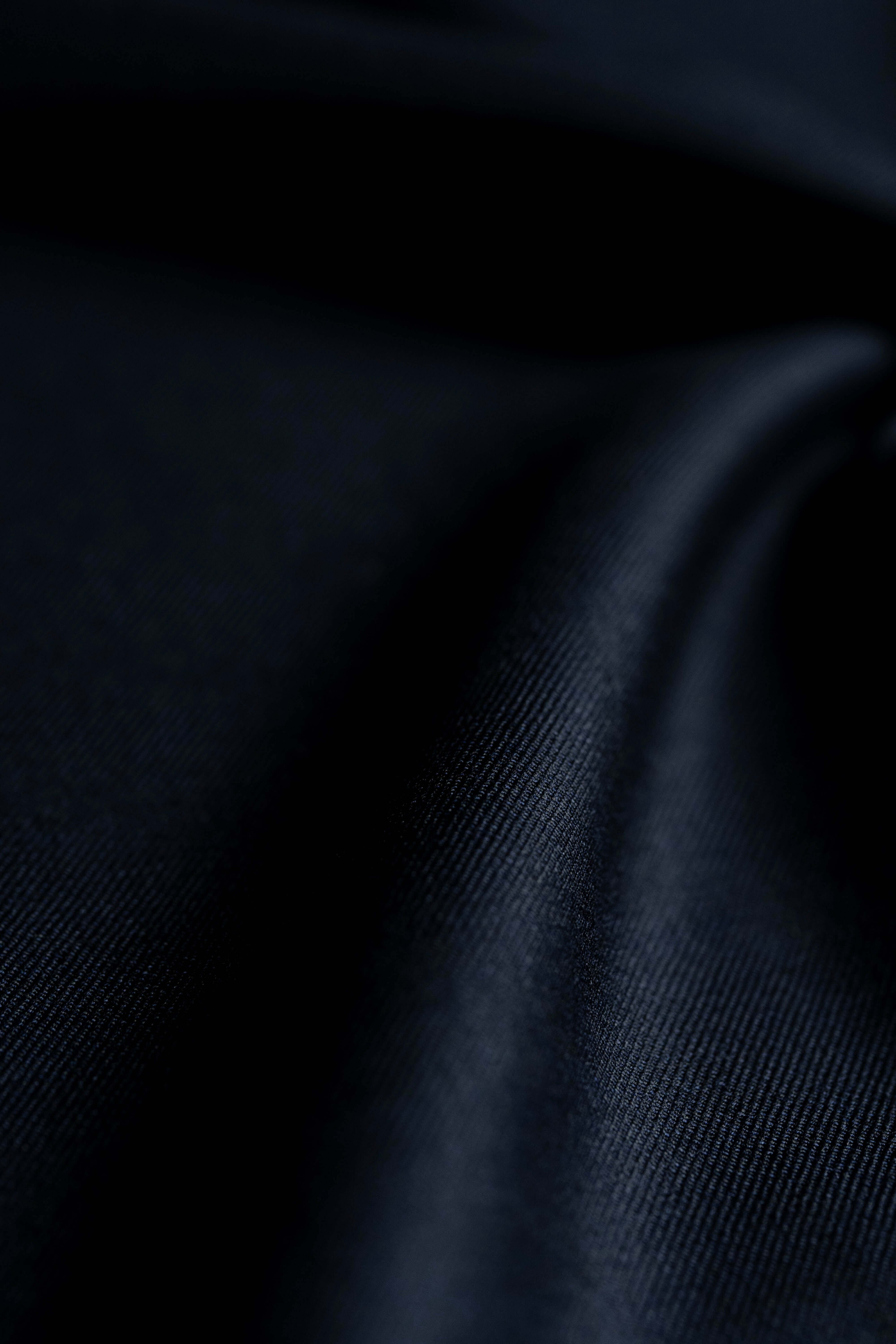 Fintex of London Midnight Navy Wool Suit Fabric close-up, showcasing its luxurious texture and rich color.